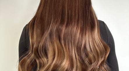Beautiful wavy brown hair styled at Hair at Mollys, Cardiff, Wales, GB, showcasing shine and volume.