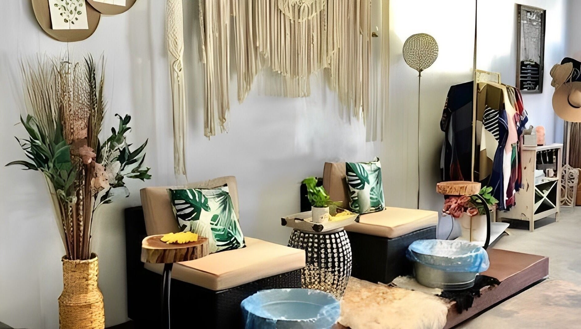 Stylish seating area at Sophisticated Lash & Nail Spa in West Palm Beach, Florida, US with boho decor.