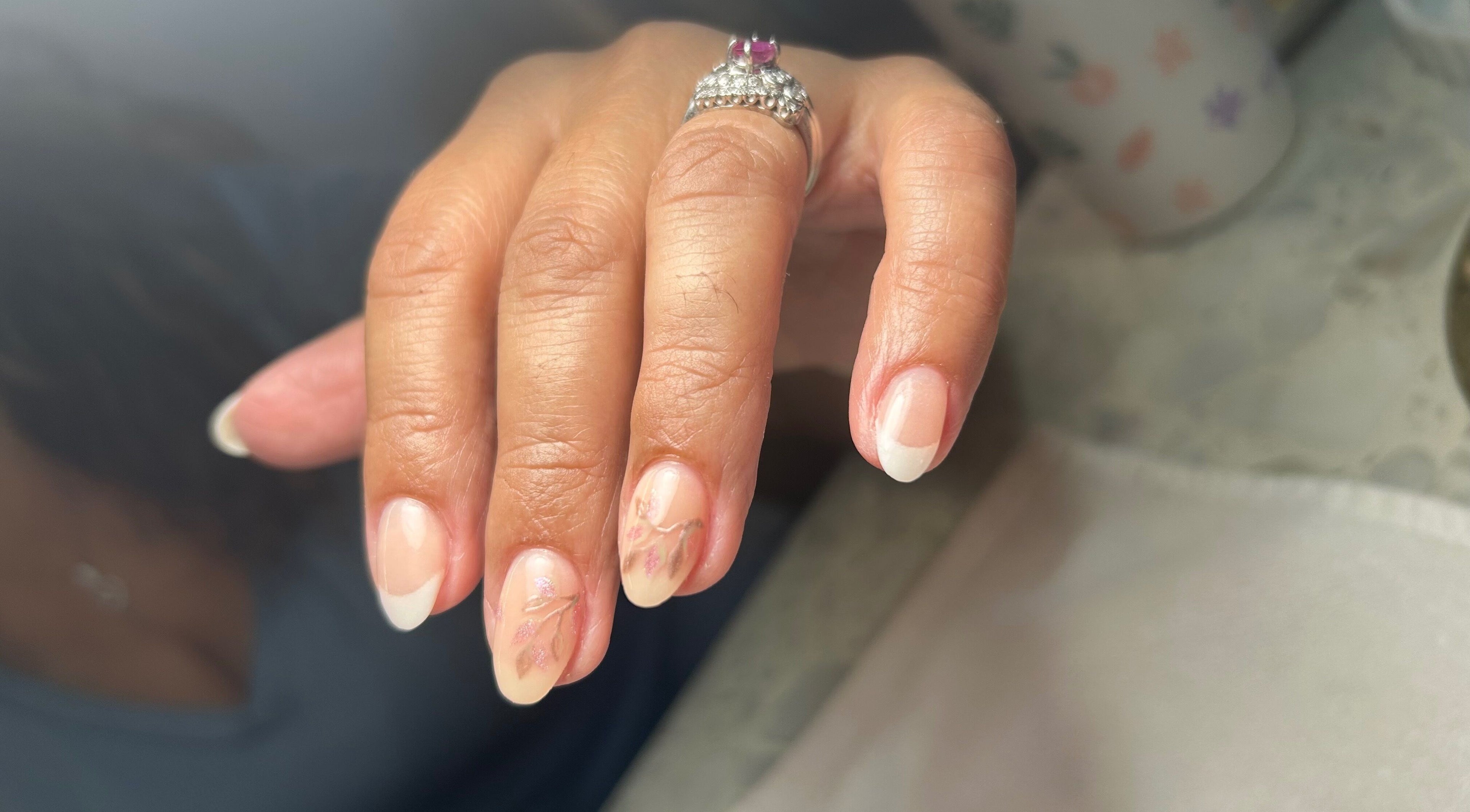 Elegant nail design with flowers at Sophisticated Lash & Nail Spa, West Palm Beach, Florida, US.