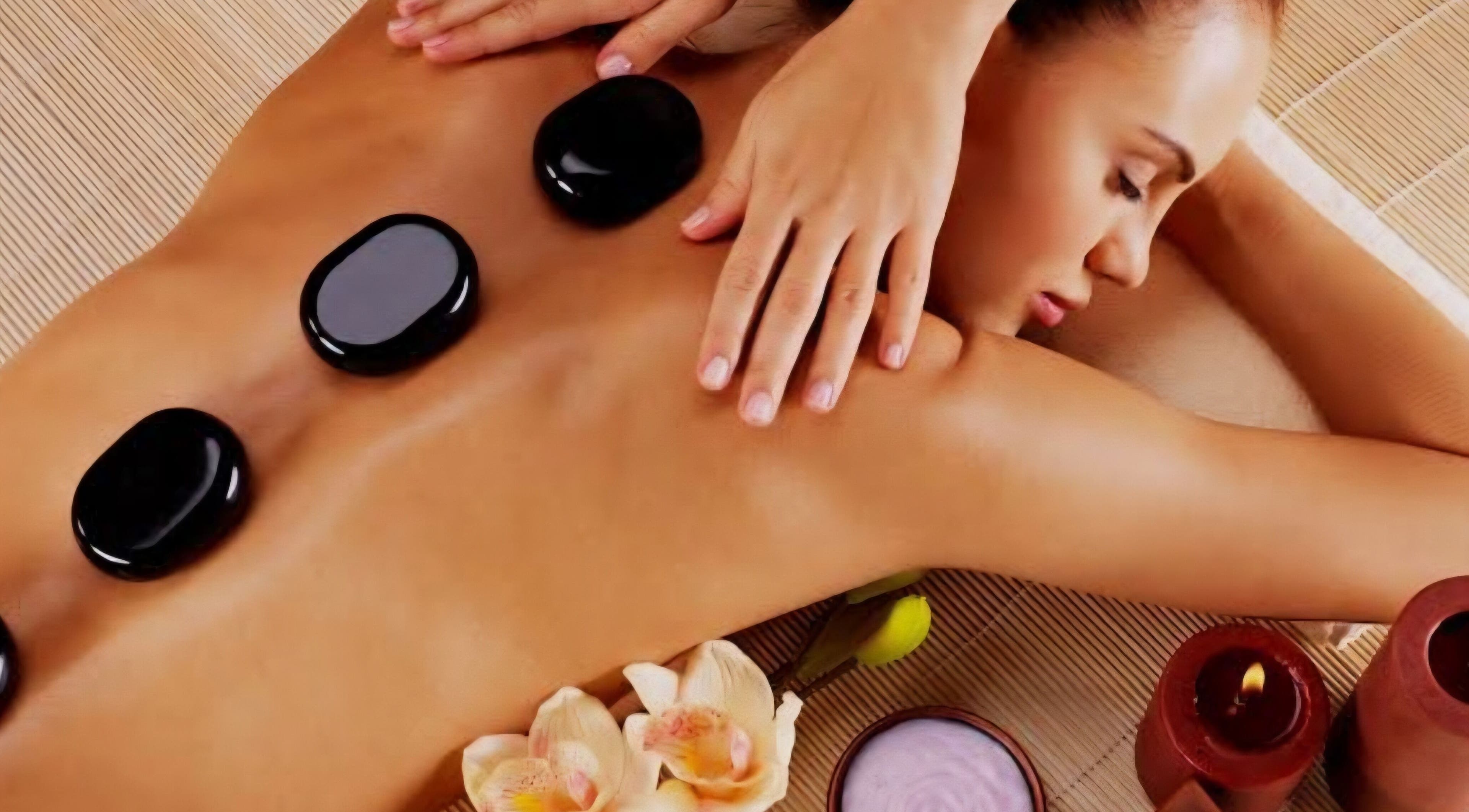 Hot stone massage at M.B.C. Beauty Clinic, Gateshead, England, GB, promoting relaxation and wellness.