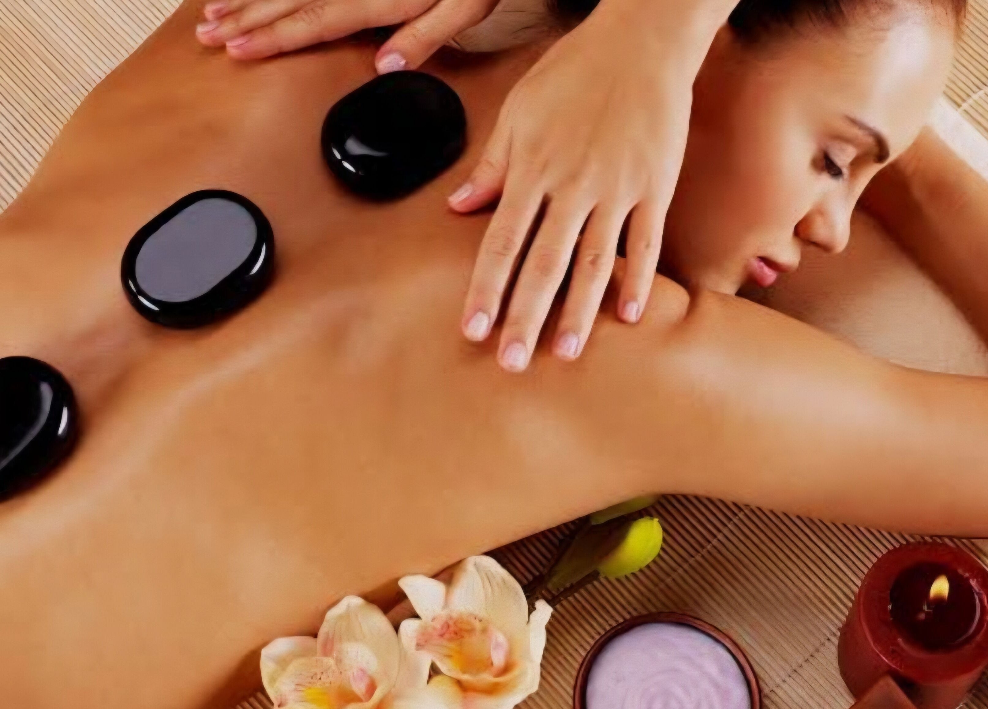 Relaxing hot stone massage at M.B.C. Beauty Clinic, Gateshead, England, GB, enhancing wellness and tranquility.