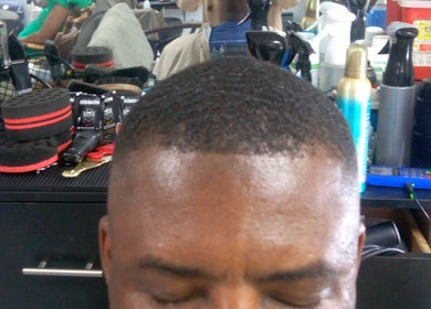 Barbershop tools and fresh haircut at The Alpha Male Barbershop, Nassau, New Providence, BS.