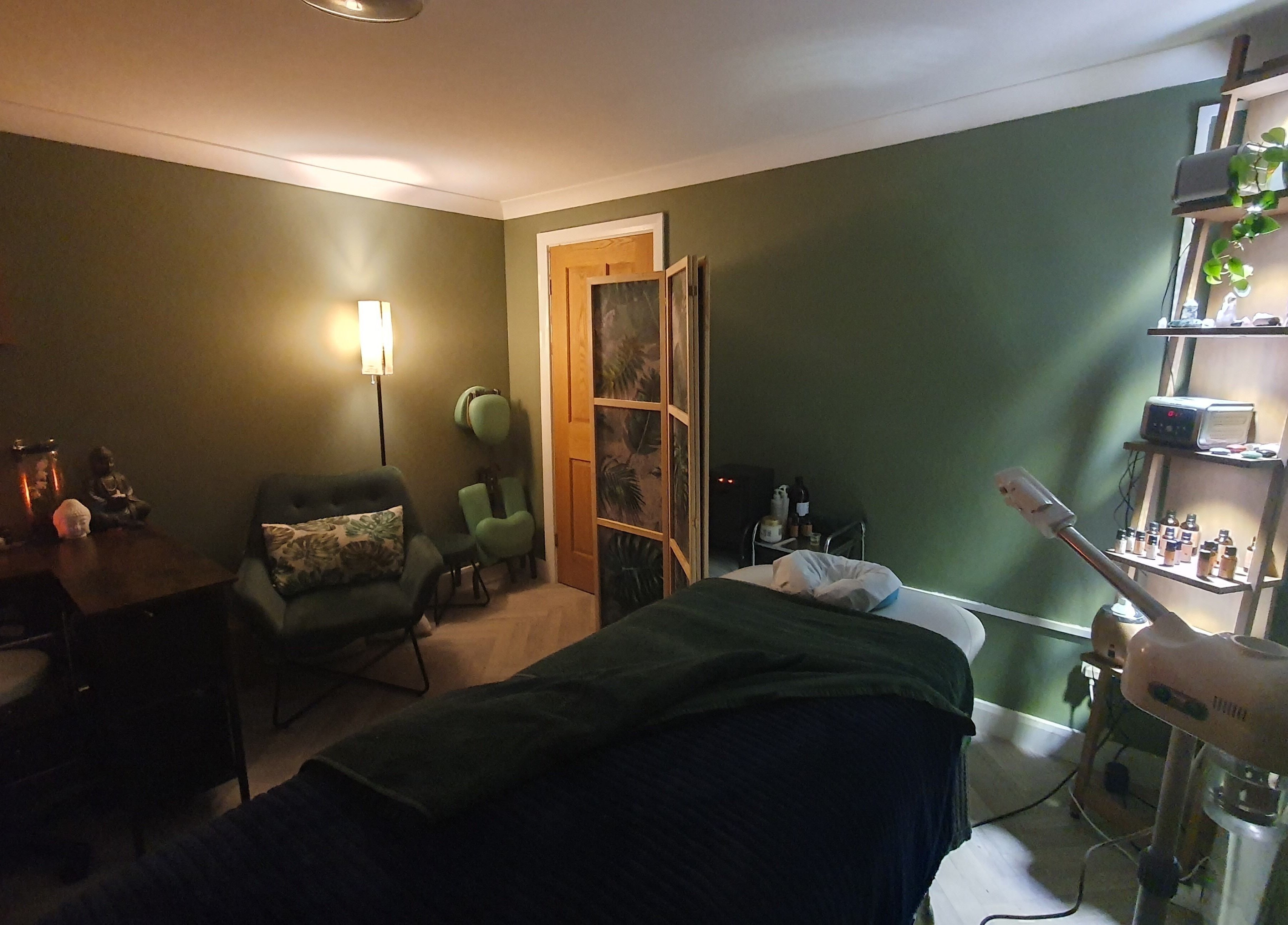 Relaxing therapy room at Monoi Therapies, Marske-by-the-sea, England, with calming decor and massage table.