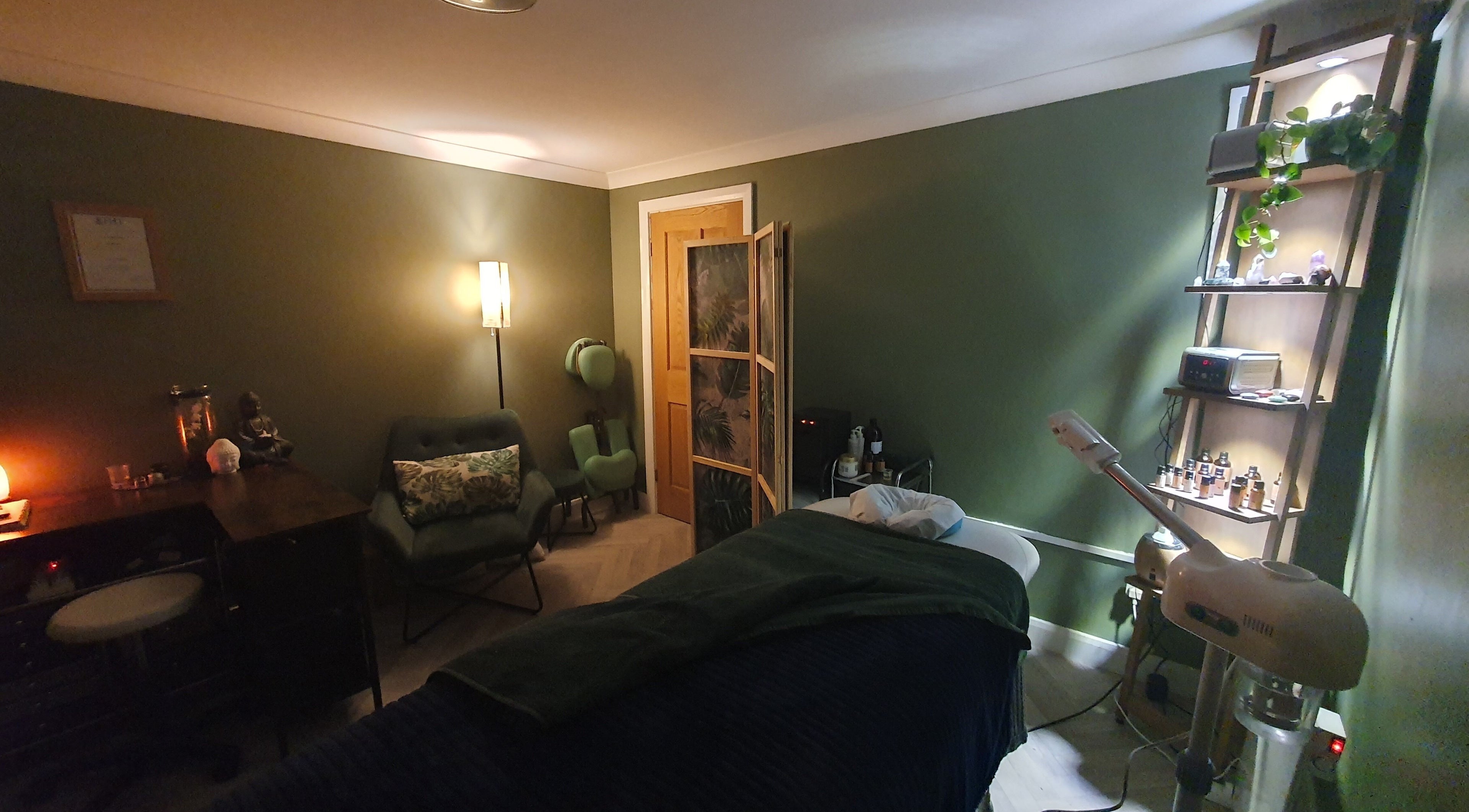 Relaxing therapy room at Monoi Therapies, Marske-by-the-sea, England, with calming decor and massage table.