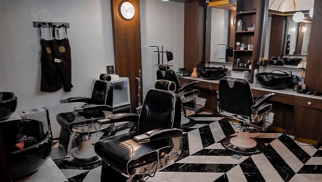 Interior of Crisp Barberia in Daerah Khusus Ibukota Jakarta featuring sleek black barber chairs and modern decor.