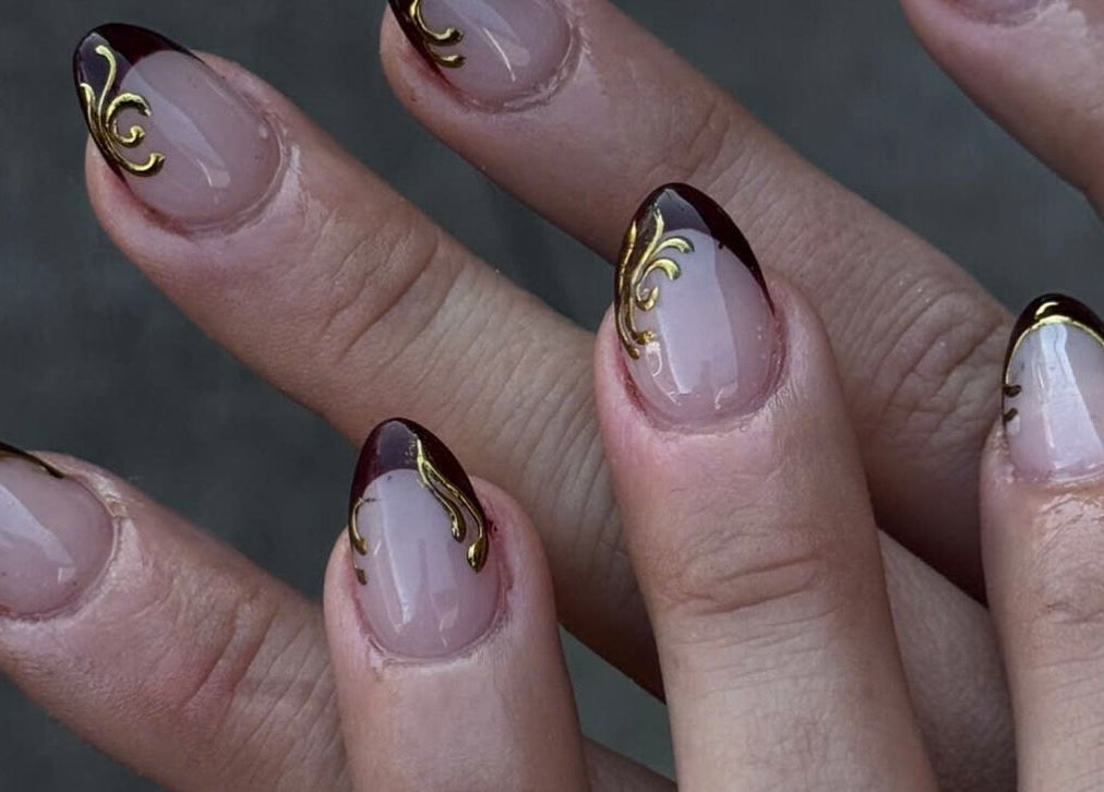 Elegant gold and dark red nail design at TH Nails and Spa Geelong West, Geelong West, Victoria, AU.