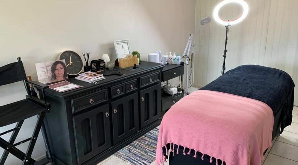 Cozy treatment room at Onyx Brows, North Mackay, Queensland, AU, featuring a pink and black styled bed.
