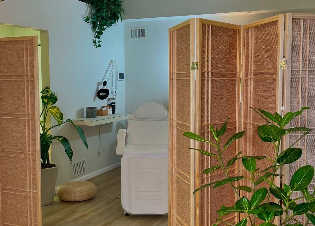Relaxing spa room at The Skin Tune, Ramsey, New Jersey, US, featuring a treatment chair and calming decor.