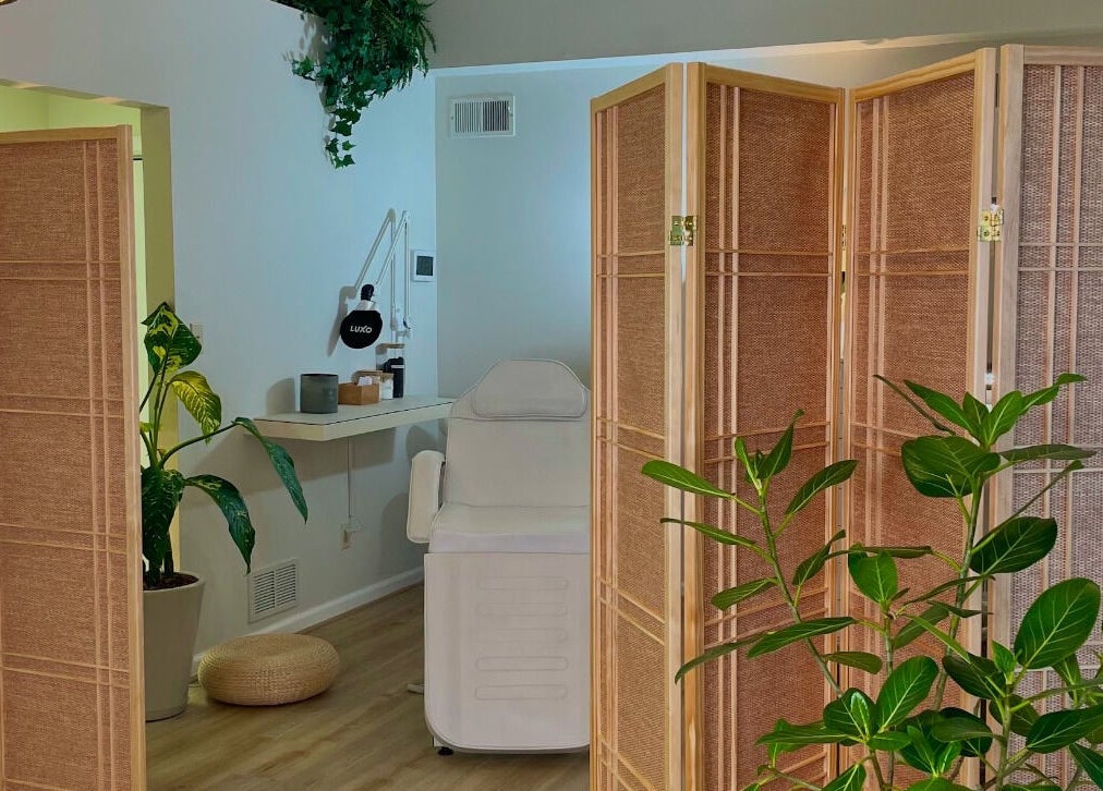 Relaxing spa room at The Skin Tune, Ramsey, New Jersey, US, featuring a treatment chair and calming decor.