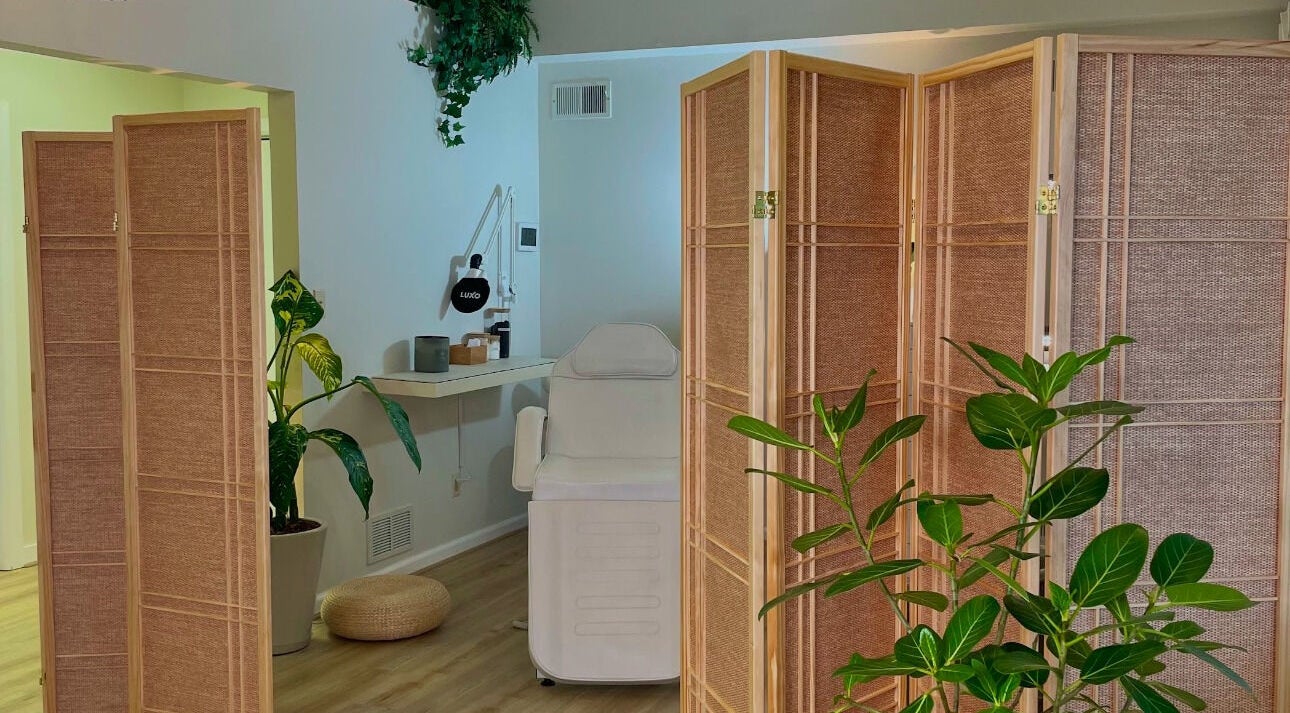 Relaxing spa room at The Skin Tune, Ramsey, New Jersey, US, featuring a treatment chair and calming decor.
