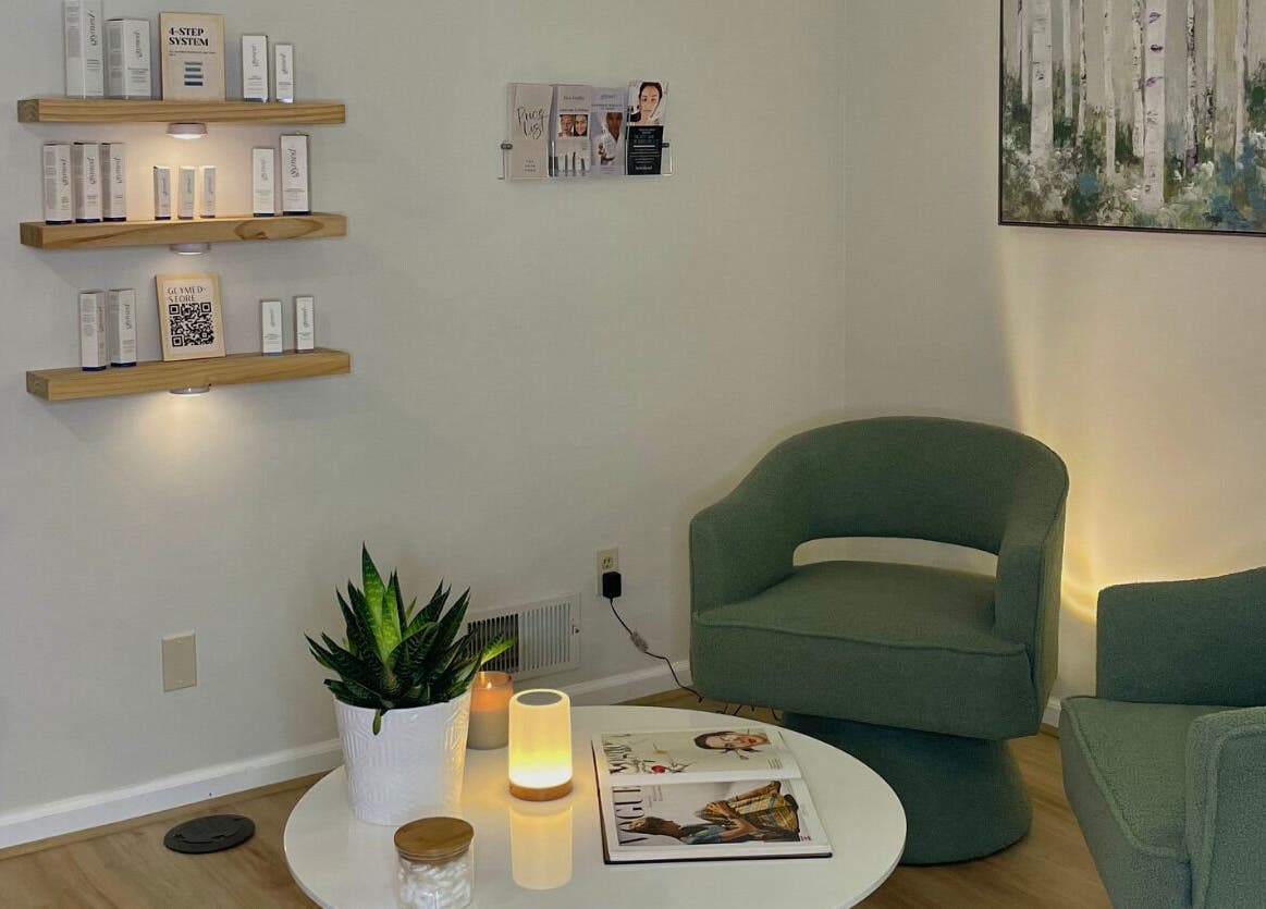 Cozy waiting area with green chairs at The Skin Tune in Ramsey, New Jersey, US, featuring skincare decor.