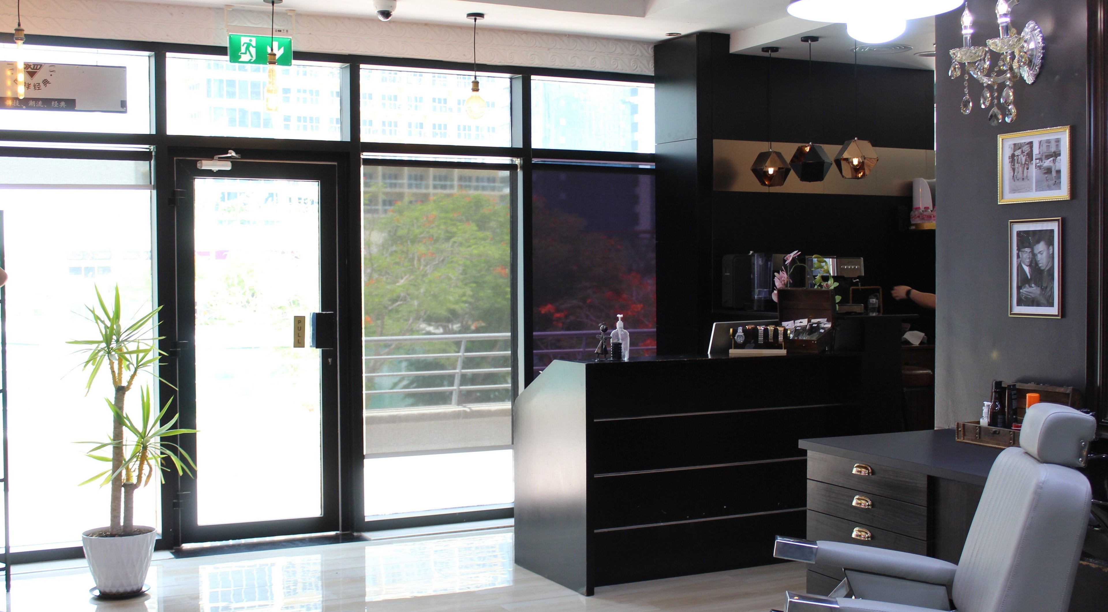 Interior of James Pro Barbers in Dubai, Dubai, AE, showcasing sleek design and modern styling chair.