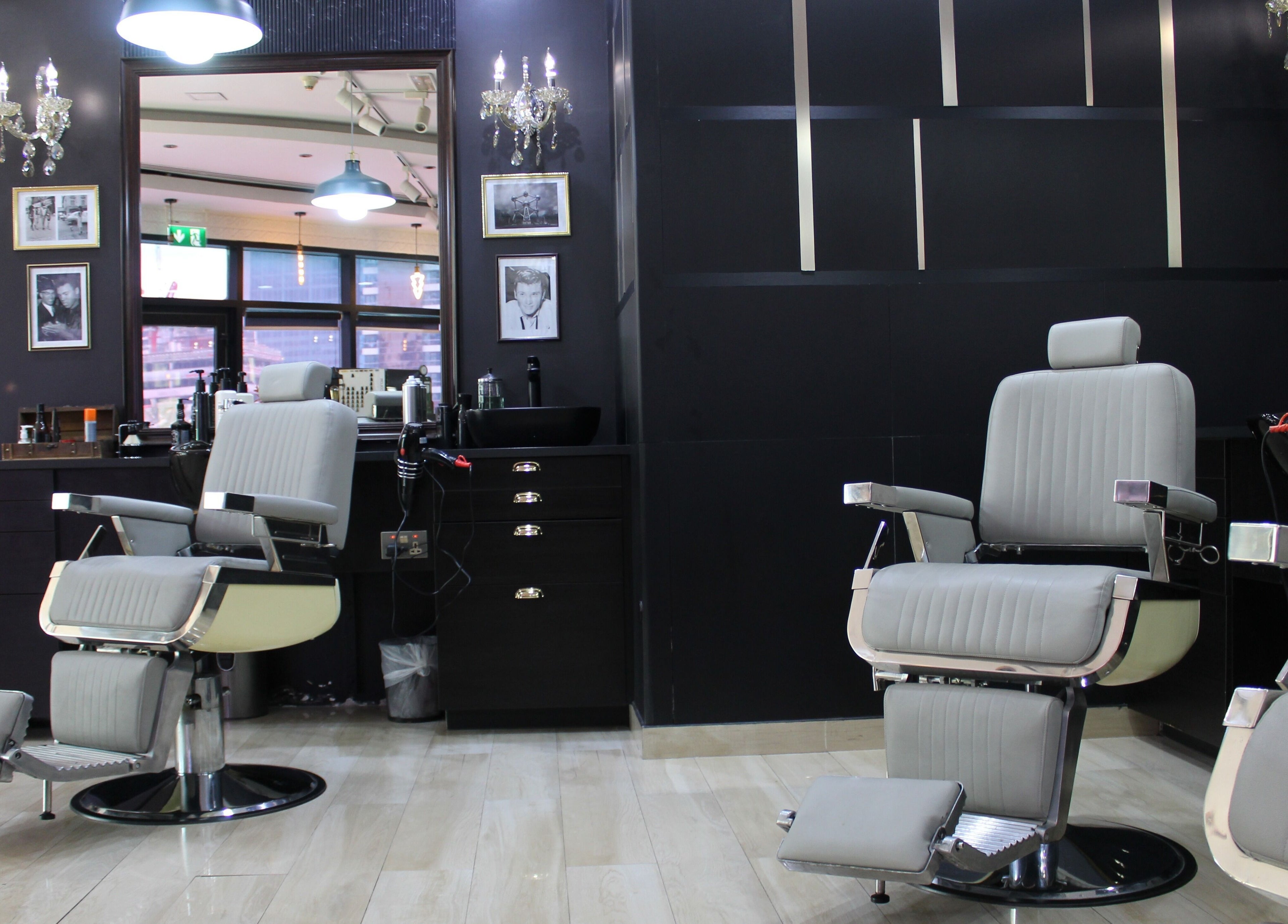 Elegant barber chairs at James Pro Barbers in Dubai, Dubai, AE, showcasing a stylish grooming environment.