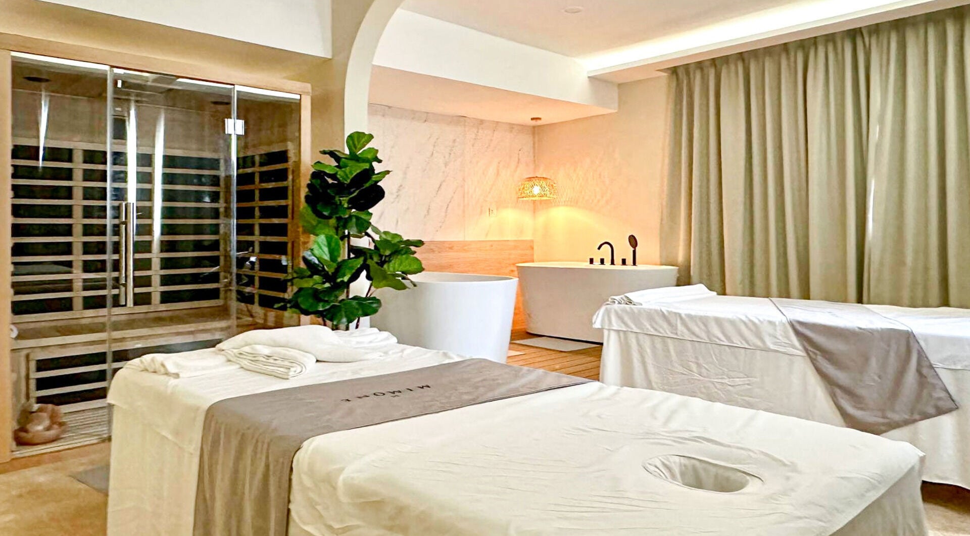 Luxurious MIMONE Spa TTDI massage room in Kuala Lumpur, Wilayah Persekutuan Kuala Lumpur, MY with elegant decor.