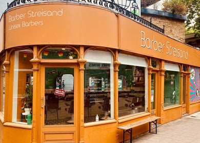 Stylish front of Barber Streisand in London, England, GB, showcasing its vibrant facade and inviting atmosphere.