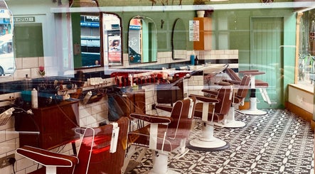 A classic barbershop interior at Barber Streisand, London, England, GB with vintage chairs and mirrors.