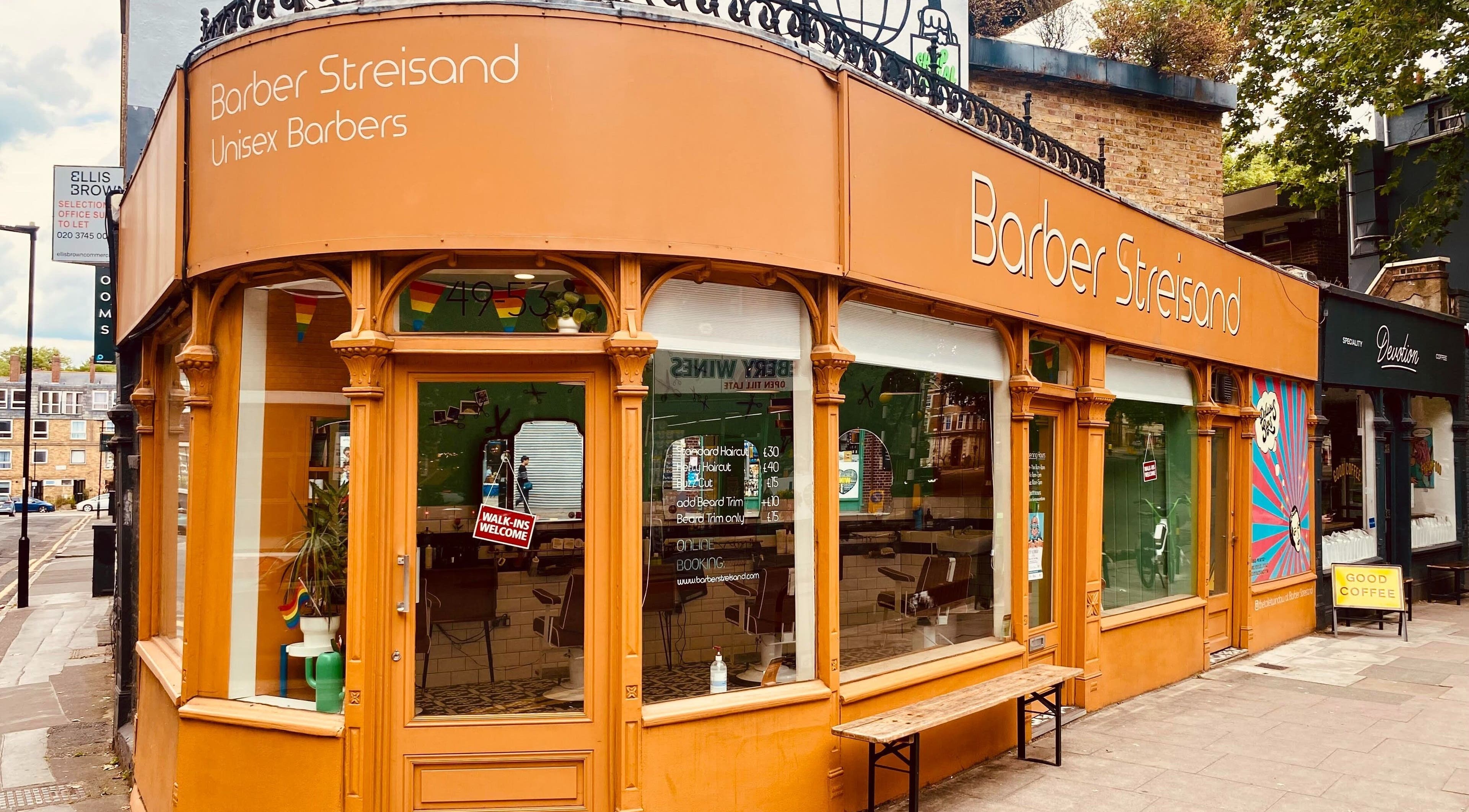 The stylish entrance of Barber Streisand in London, England, GB, showcasing unique design and welcoming vibes.