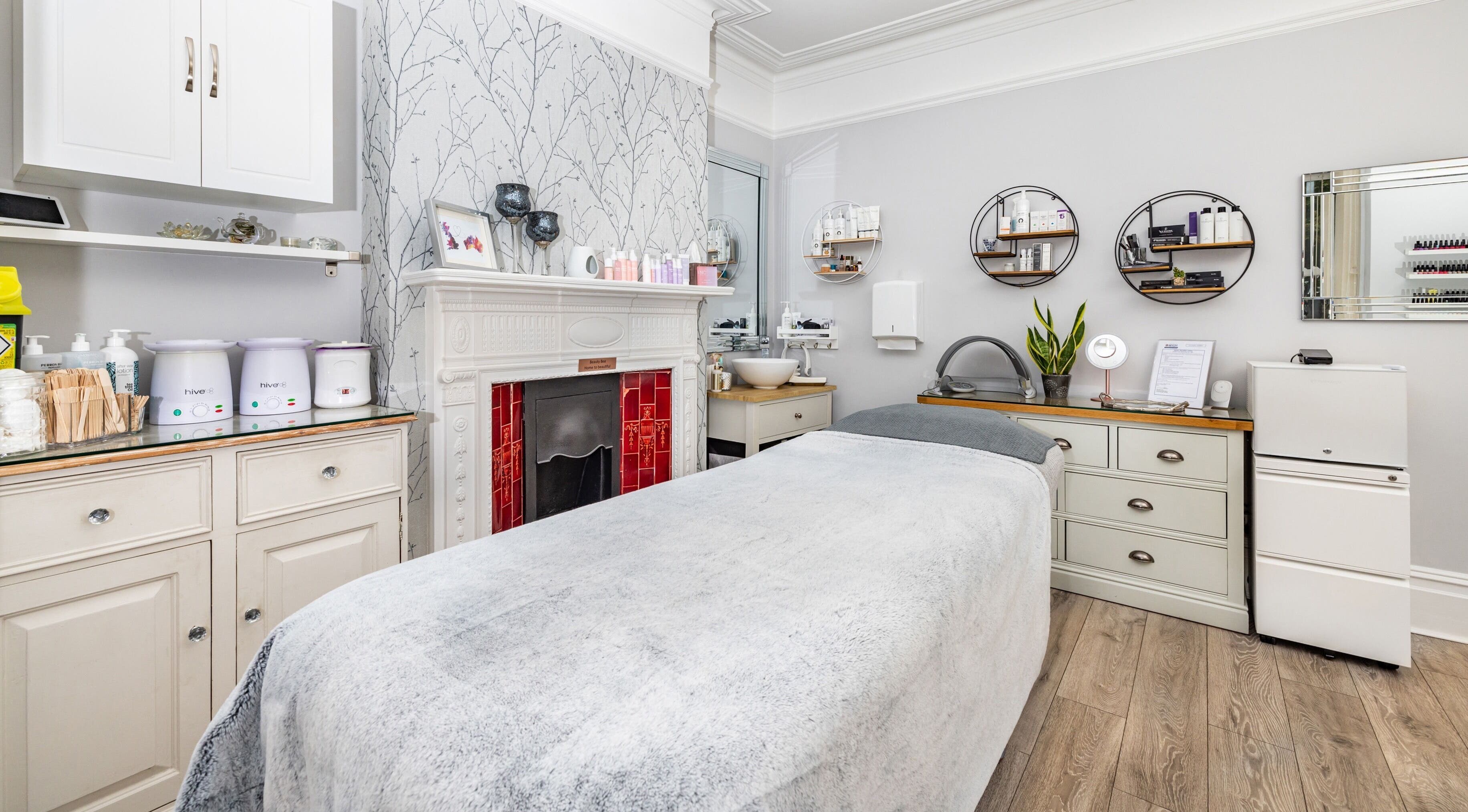 Elegant treatment room at NUYU Skin Clinic, Kent, England, GB, featuring a cozy bed and soothing decor.