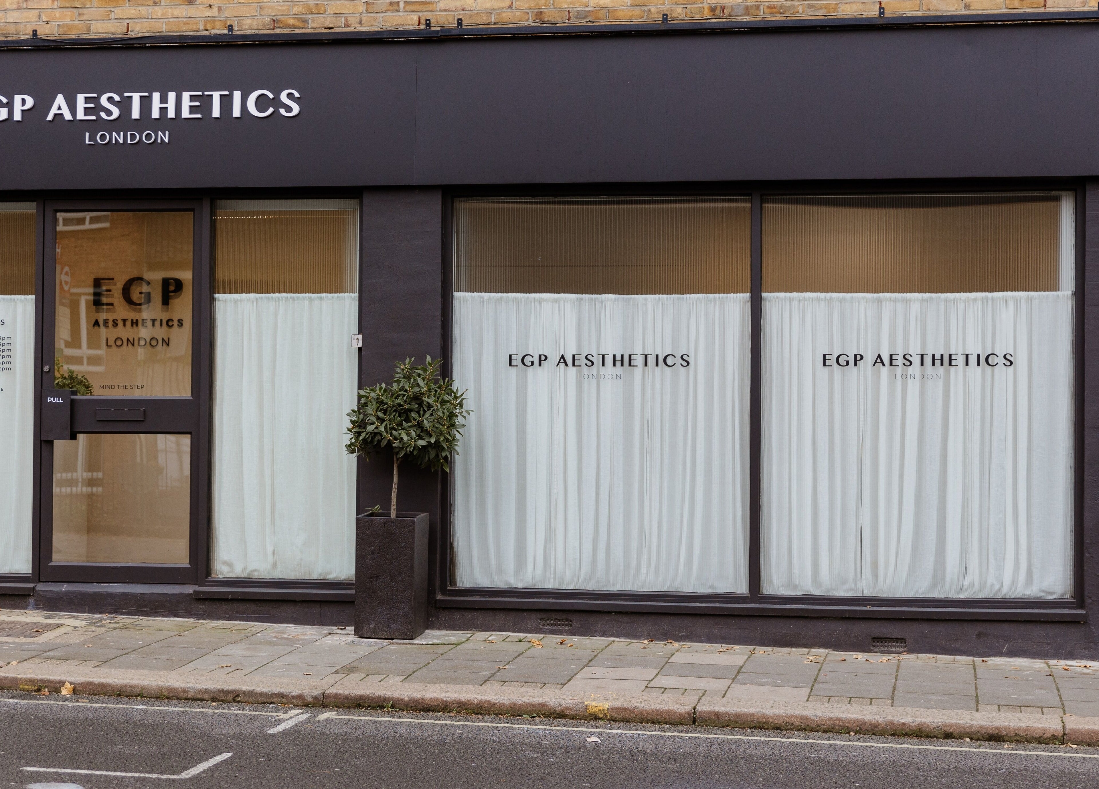 Street view of EGP Aesthetics exterior in London, England, GB with modern black and white design.