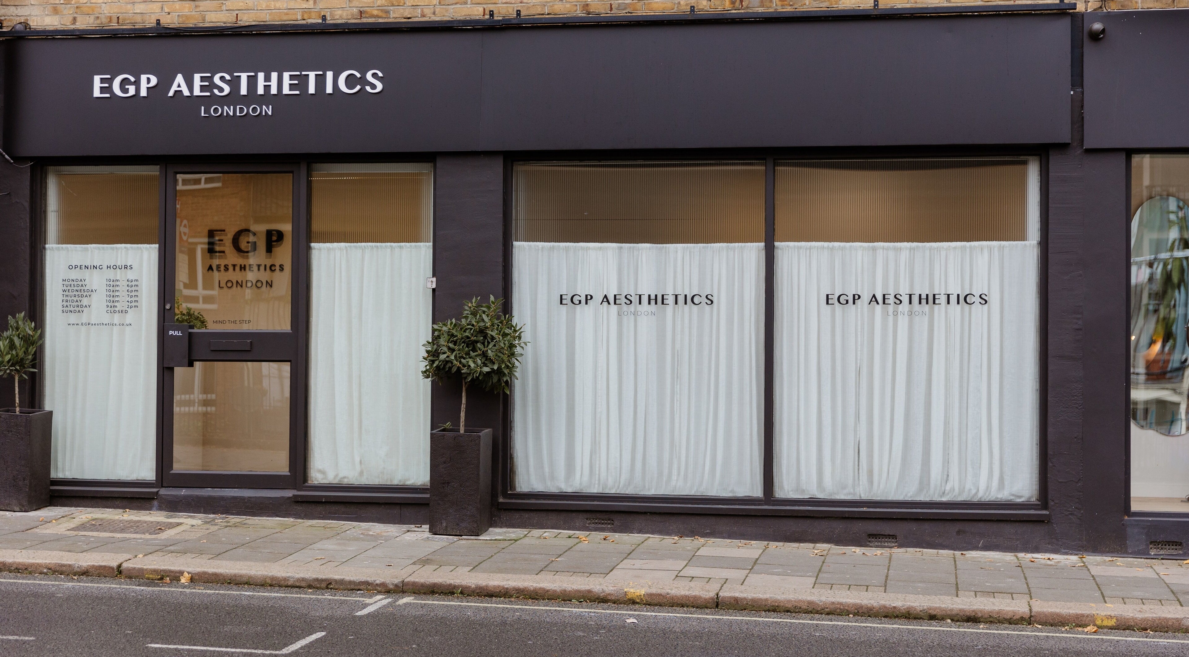 Street view of EGP Aesthetics exterior in London, England, GB with modern black and white design.