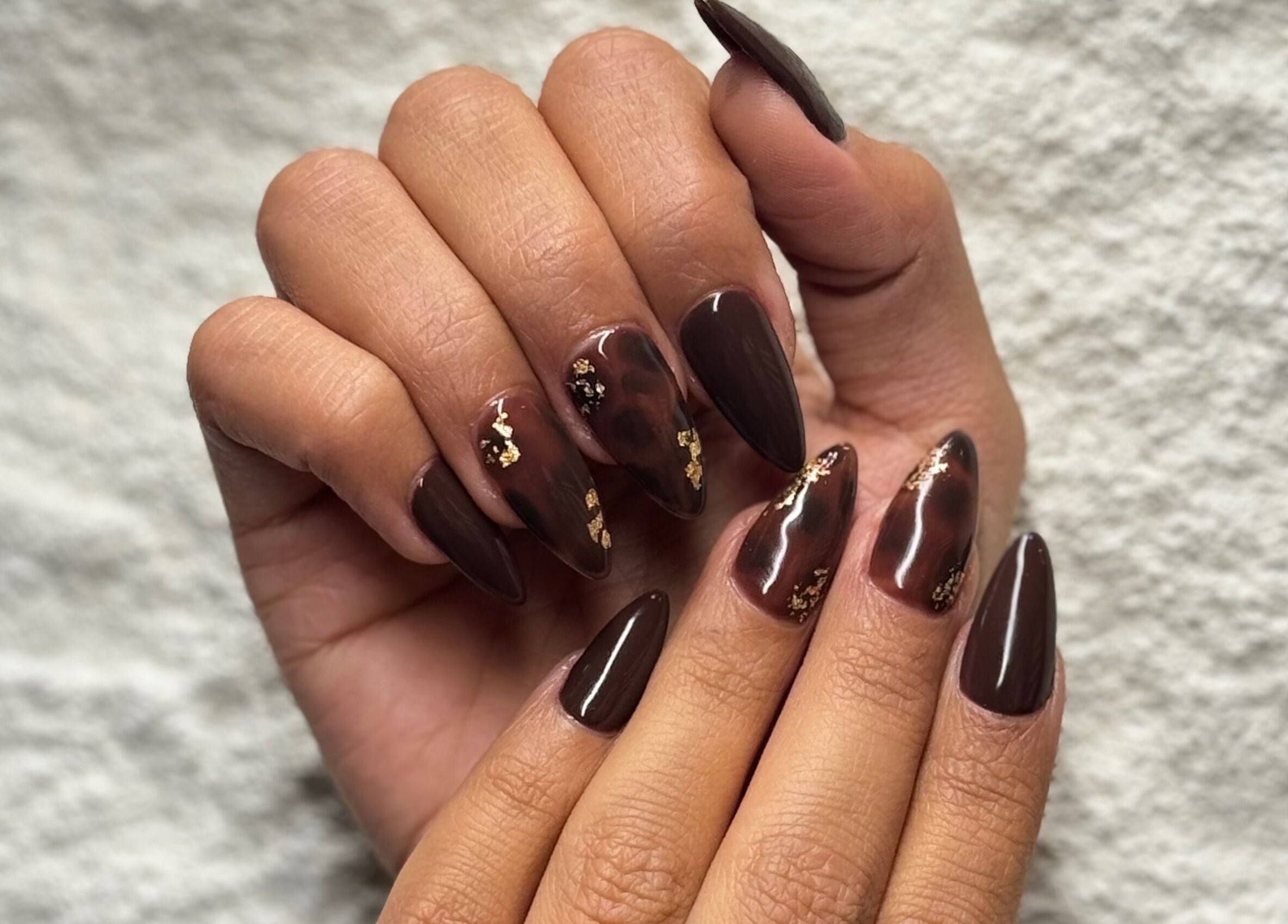 Stylish manicure with dark polish at Gloss'd Beauty Lounge | Riyadh, الرياض, منطقة الرياض, SA.