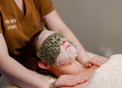 Facial treatment at The Key 2 Skin, Richmond, New South Wales, AU. Customer with a facial mask and eye cover.