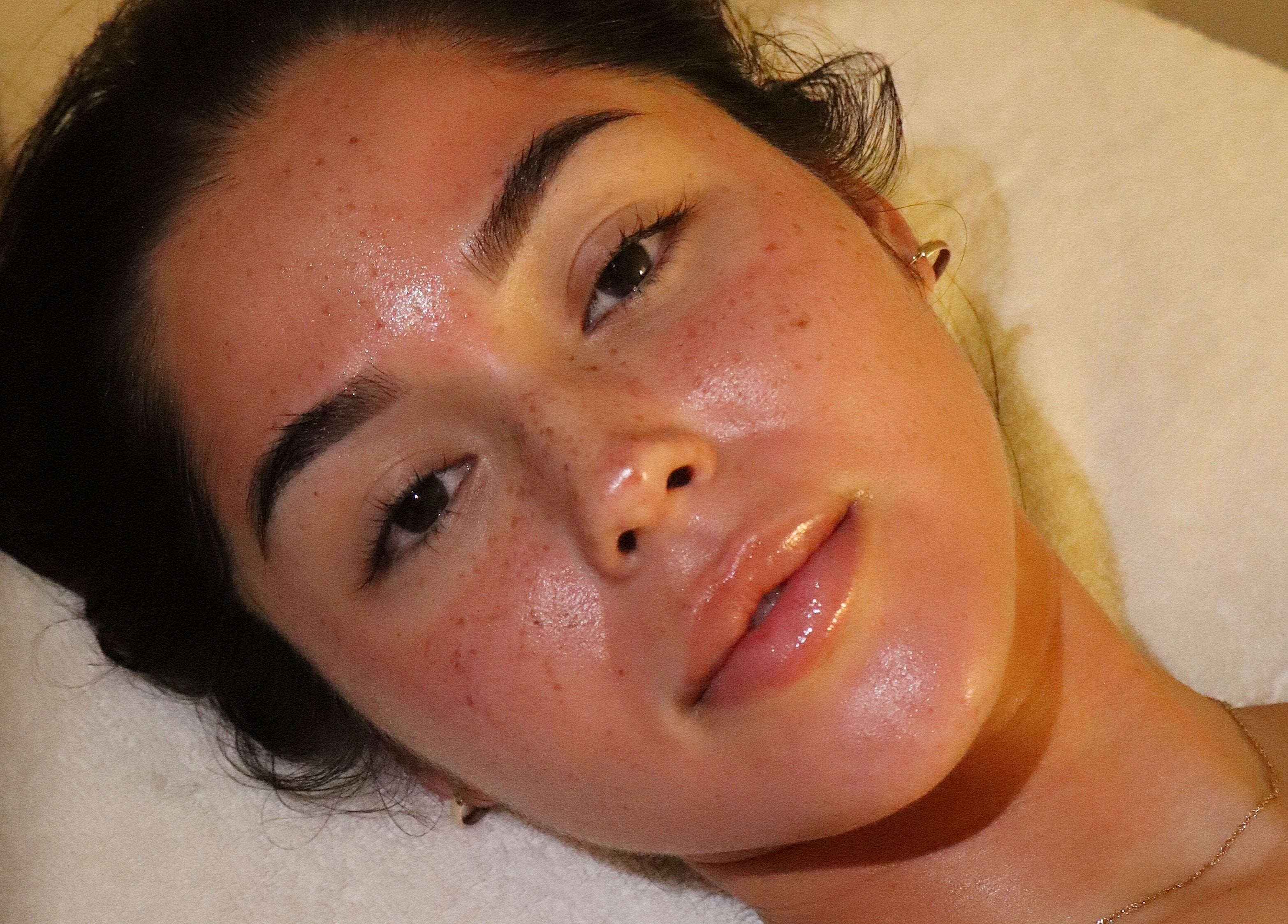 Relaxed individual receiving a facial at The Key 2 Skin, Richmond, New South Wales, AU for a radiant complexion.