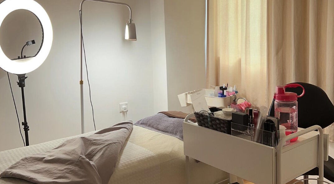 Relaxing spa room at M Beaute Plaza Arkadia, Kuala Lumpur, featuring a treatment bed and beauty equipment.