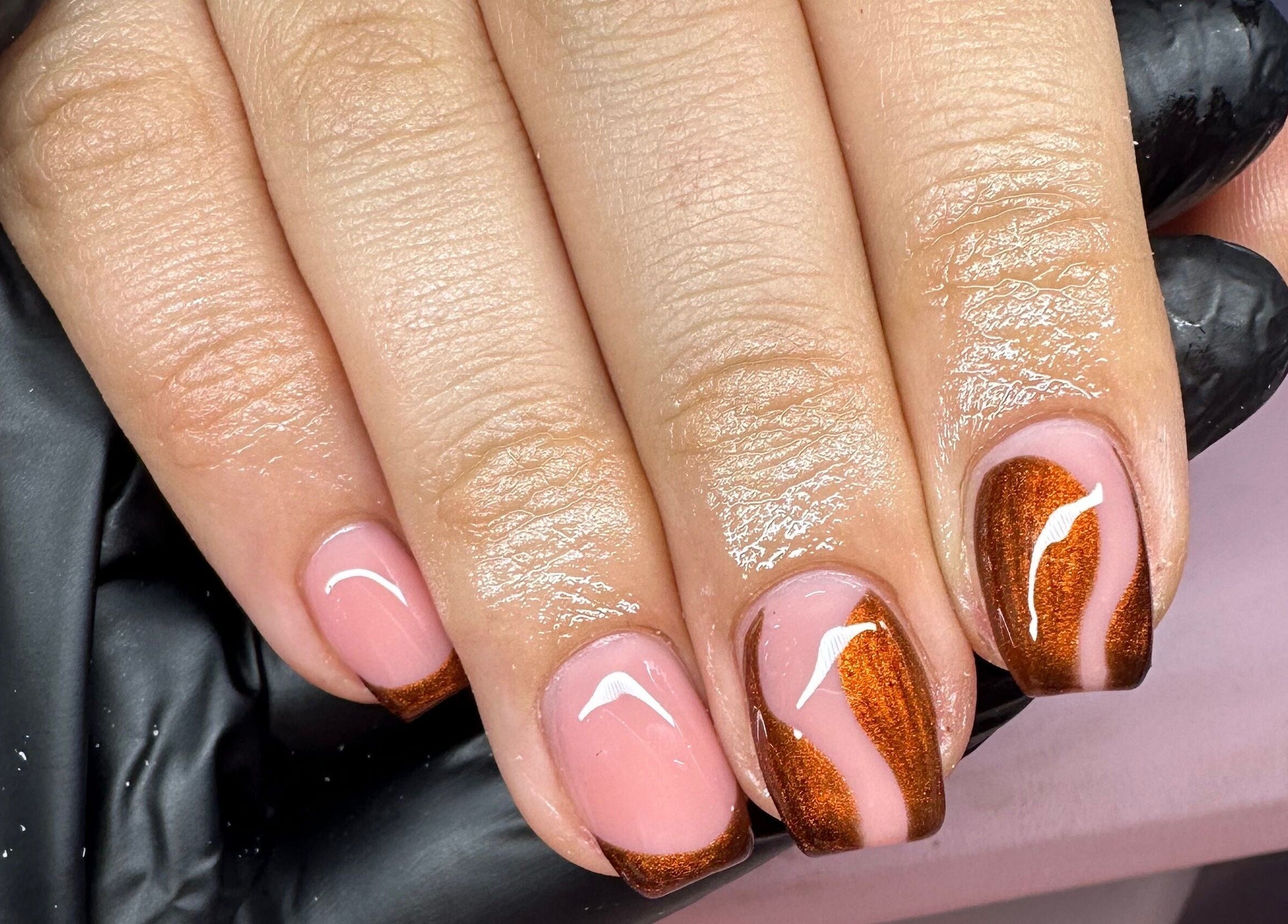 Stunning nail art at Hello Beautiful, Lytham, England, GB, featuring a brown and pink design.