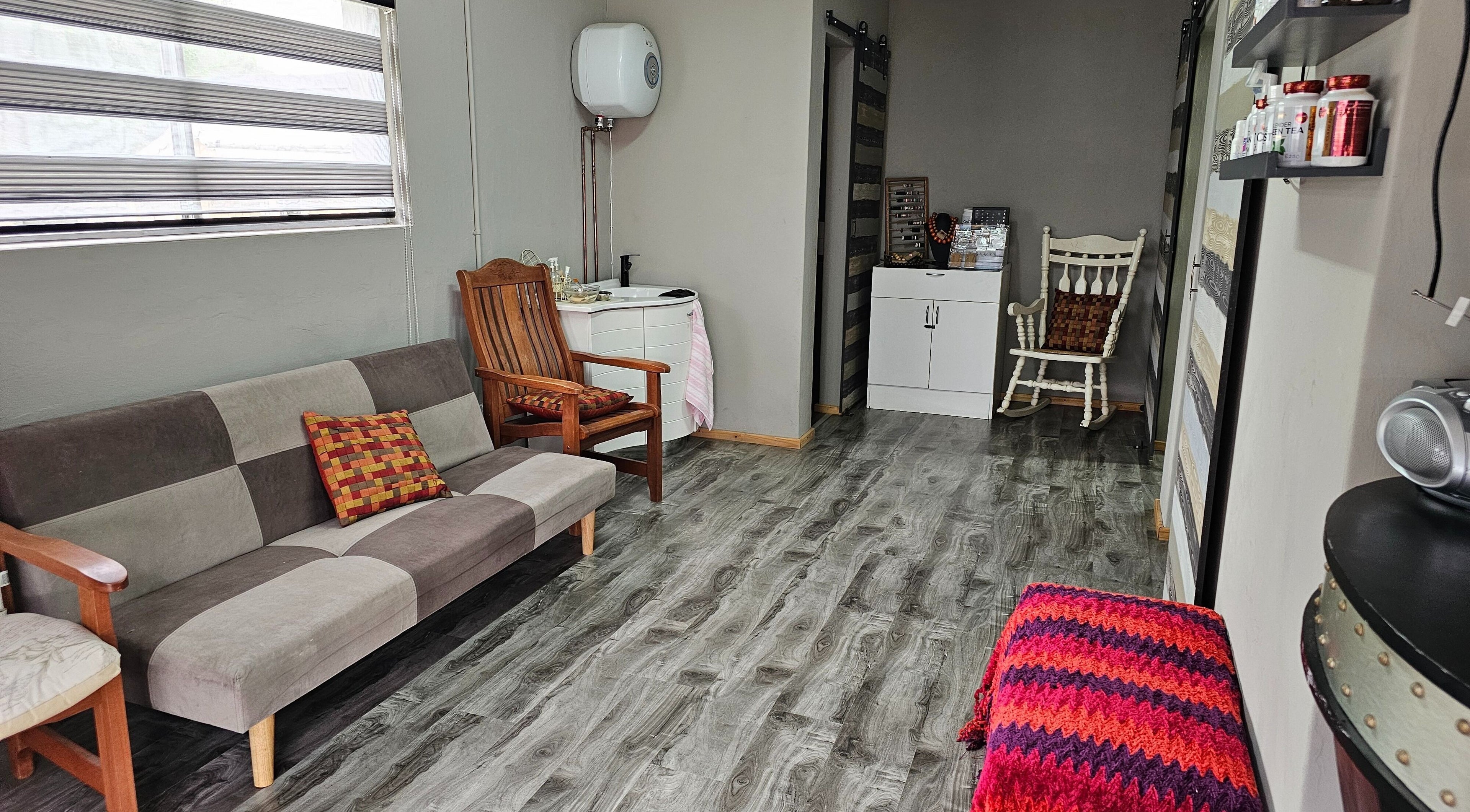 Relaxing seating area inside Mille Perfecto Beauty, Boksburg, Gauteng, ZA, showcasing modern and rustic decor.