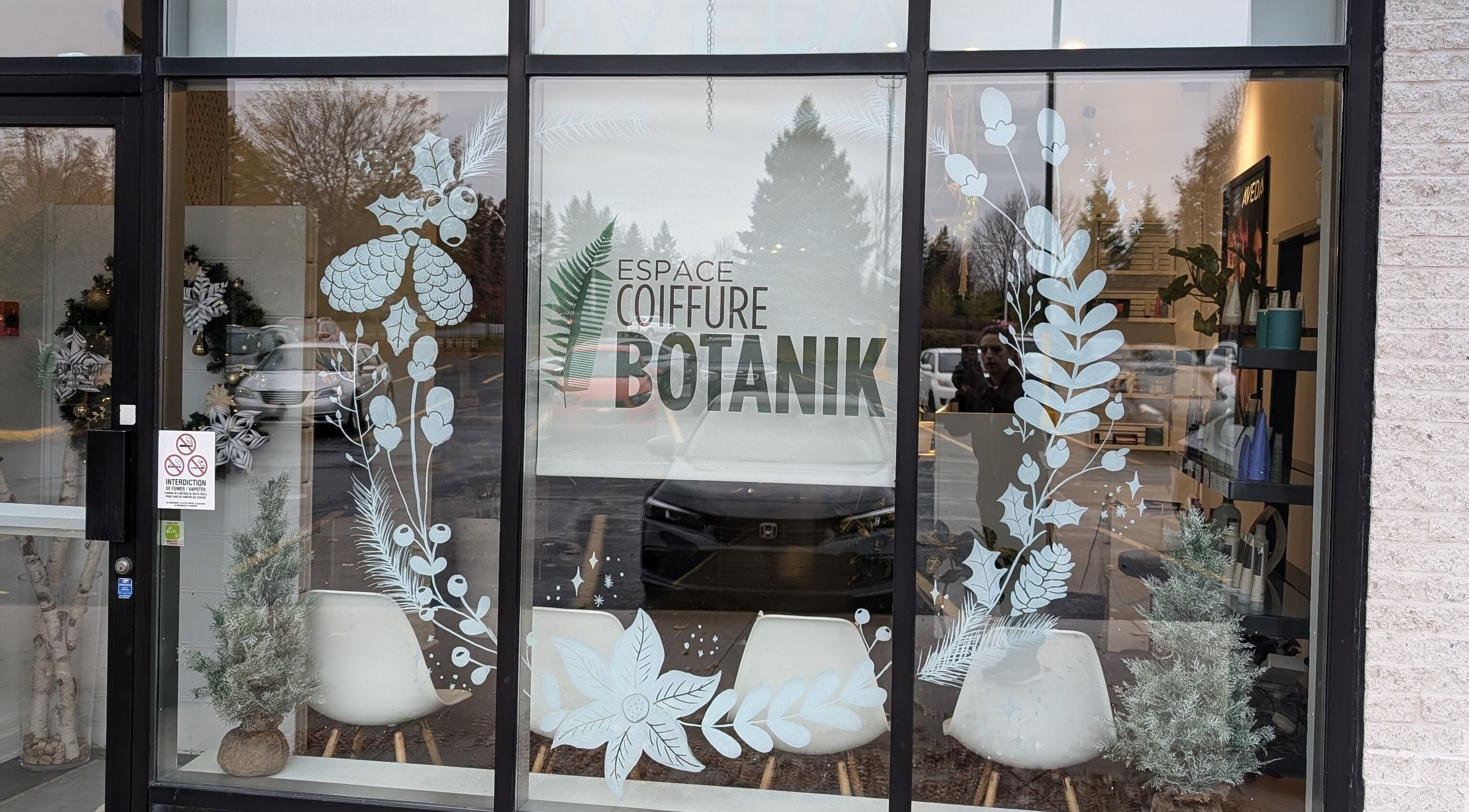 Espace Coiffure Botanik facade in Saint-Bruno-de-Montarville, Québec, CA with botanical window decor.