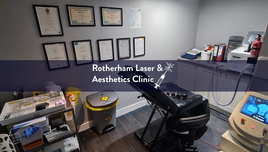 Treatment room at Rotherham Laser and Aesthetic Clinic, Parkgate, England, GB, showcasing certificates and equipment.