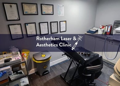 Treatment room at Rotherham Laser and Aesthetic Clinic, Parkgate, England, GB, showcasing certificates and equipment.