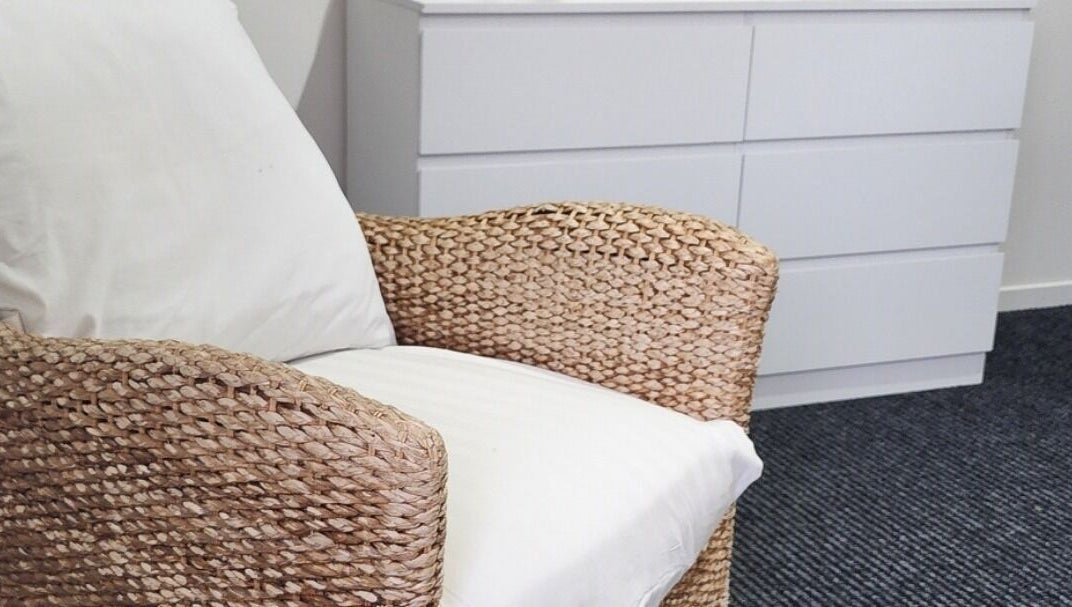 Comfortable woven chair at Face Edit - Beauty Edition, Auckland, Auckland, NZ. Perfect for relaxation.