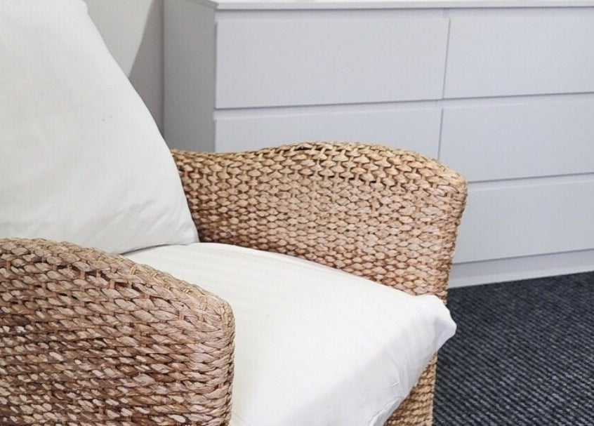 Comfortable woven chair at Face Edit - Beauty Edition, Auckland, Auckland, NZ. Perfect for relaxation.