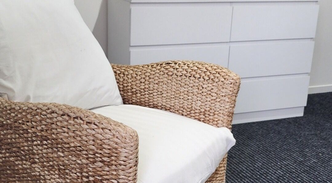 Comfortable woven chair at Face Edit - Beauty Edition, Auckland, Auckland, NZ. Perfect for relaxation.