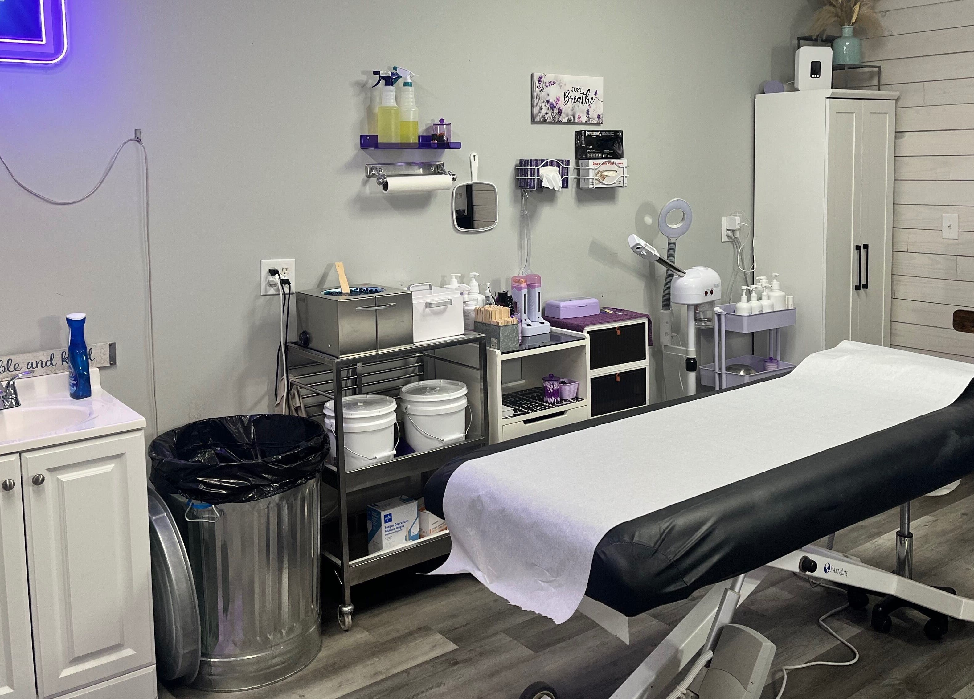 A tranquil waxing room at The Wax Pot - Trenton, featuring treatment bed and supplies in Trenton, Florida, US.