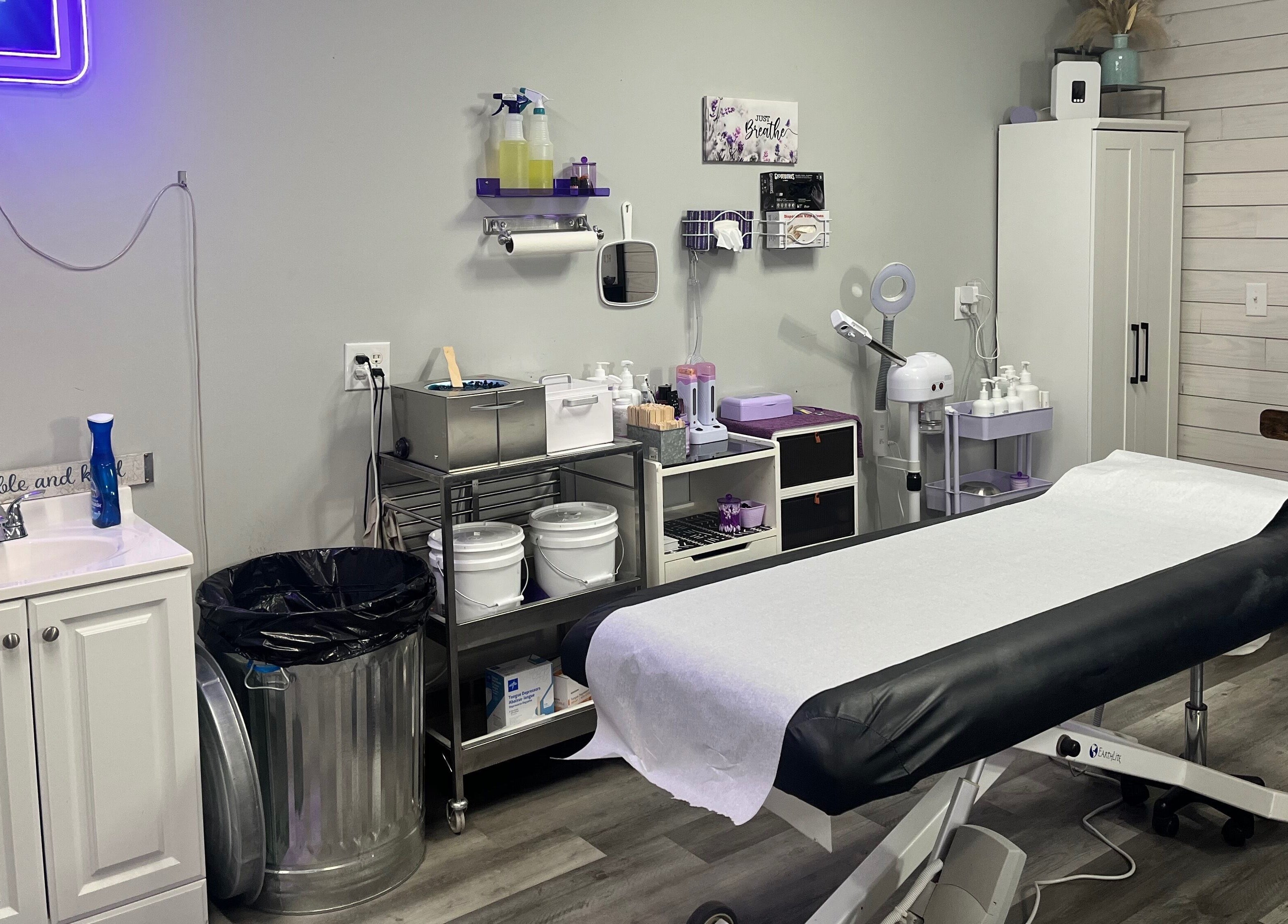 A tranquil waxing room at The Wax Pot - Trenton, featuring treatment bed and supplies in Trenton, Florida, US.