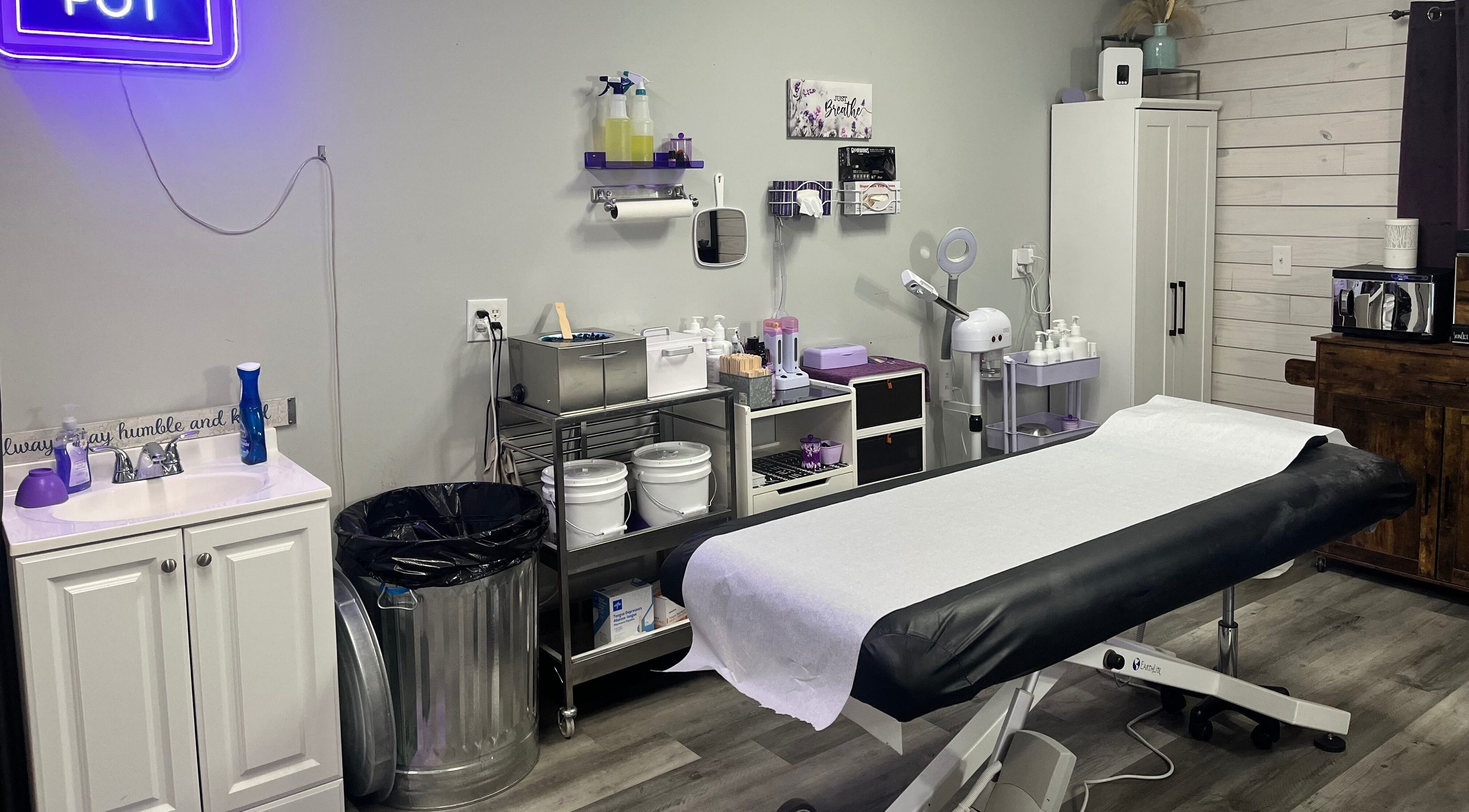 A tranquil waxing room at The Wax Pot - Trenton, featuring treatment bed and supplies in Trenton, Florida, US.