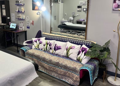 Cozy treatment room at The Wax Pot - Trenton, featuring a floral sofa and elegant decor in Trenton, Florida, US.
