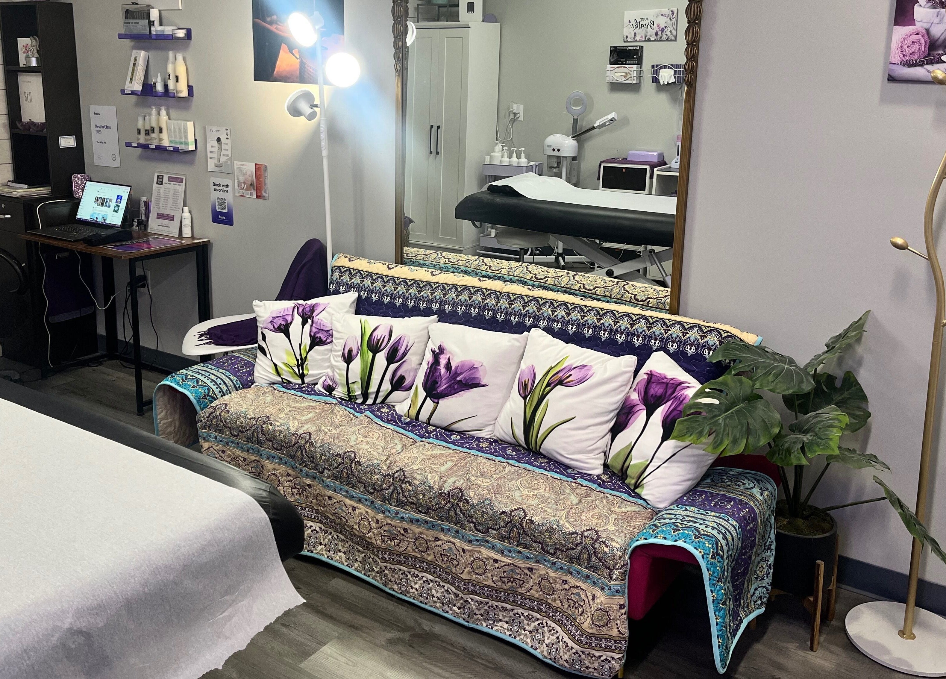 Cozy treatment room at The Wax Pot - Trenton, featuring a floral sofa and elegant decor in Trenton, Florida, US.