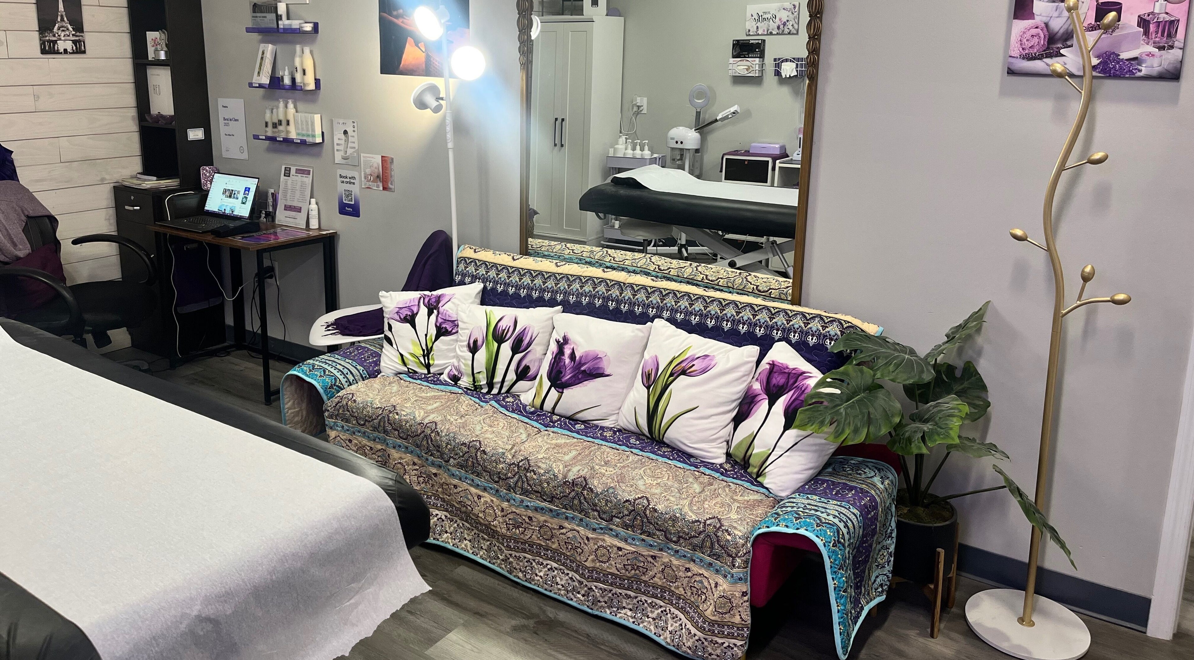 Cozy treatment room at The Wax Pot - Trenton, featuring a floral sofa and elegant decor in Trenton, Florida, US.
