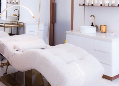 Luxurious treatment room at Silq Beauty Salon, Dubai, Dubai, AE, featuring plush massage table and elegant decor.