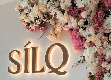 Silq Beauty Salon sign with elegant floral display in Dubai, Dubai, AE.