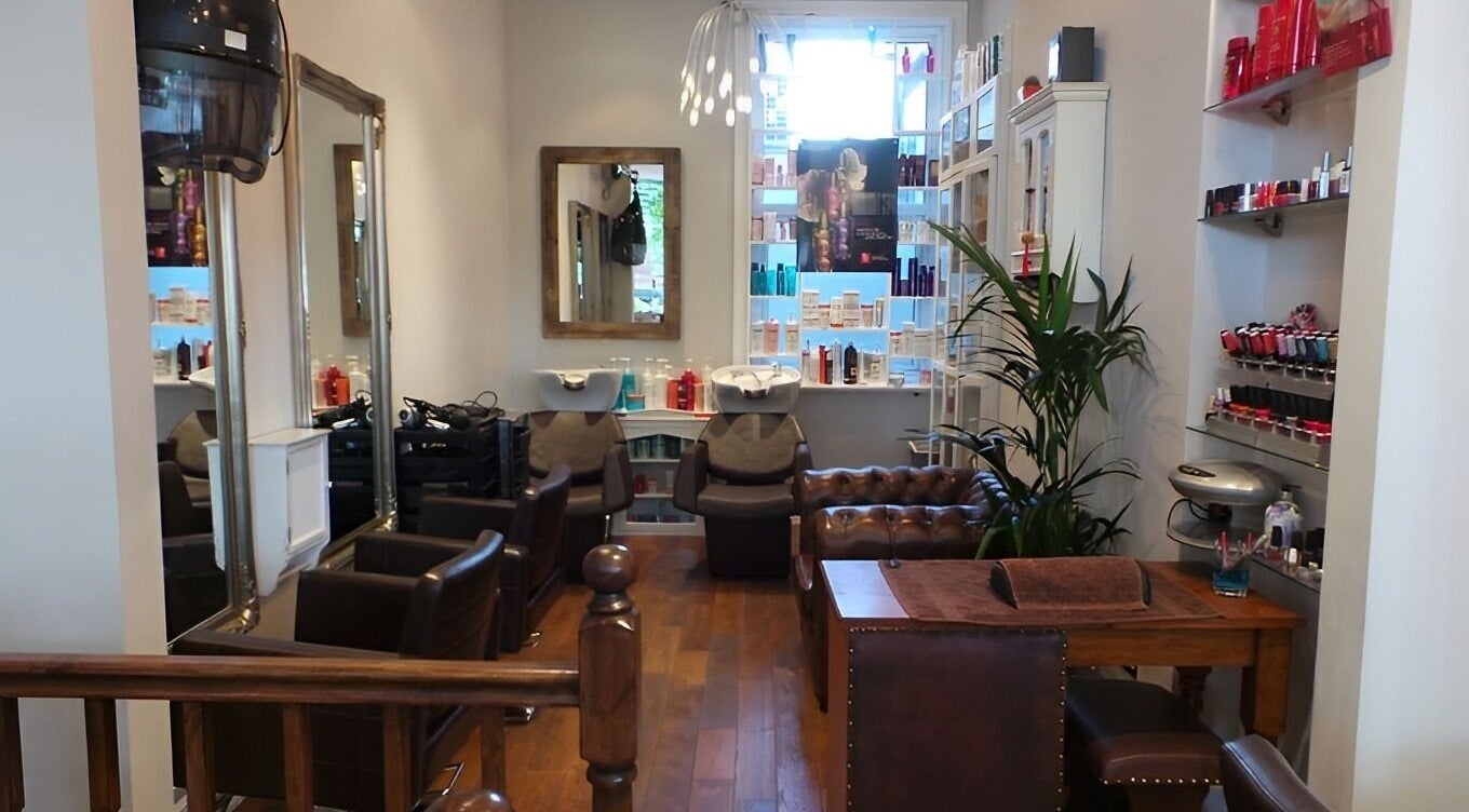 Elegant interior of Crystalise Salon - West Hampstead, London, England, GB showcasing chairs and beauty products.