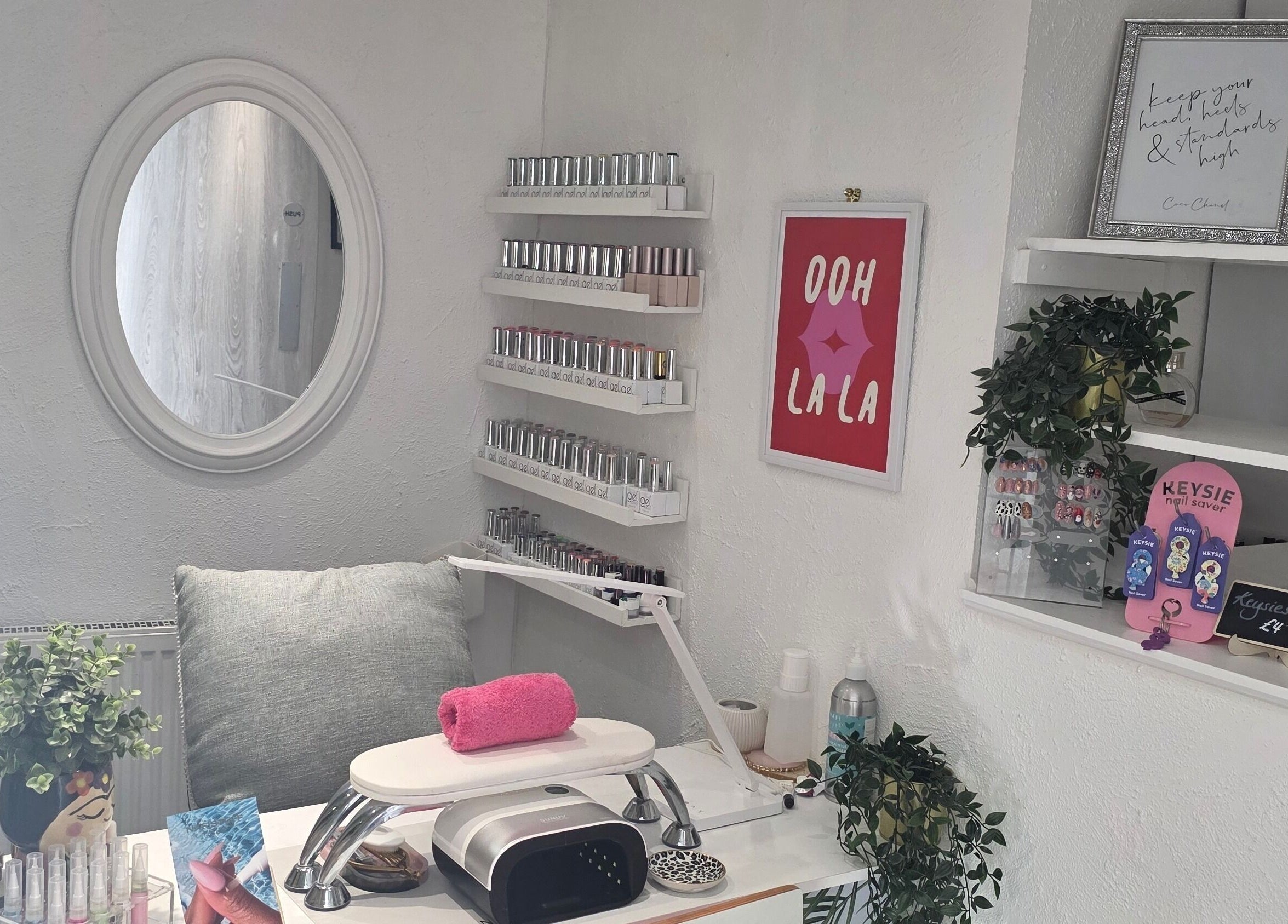 Elegant nail station at Adore Beauty, Aberdeen, Scotland, GB. Features polish display and modern decor.