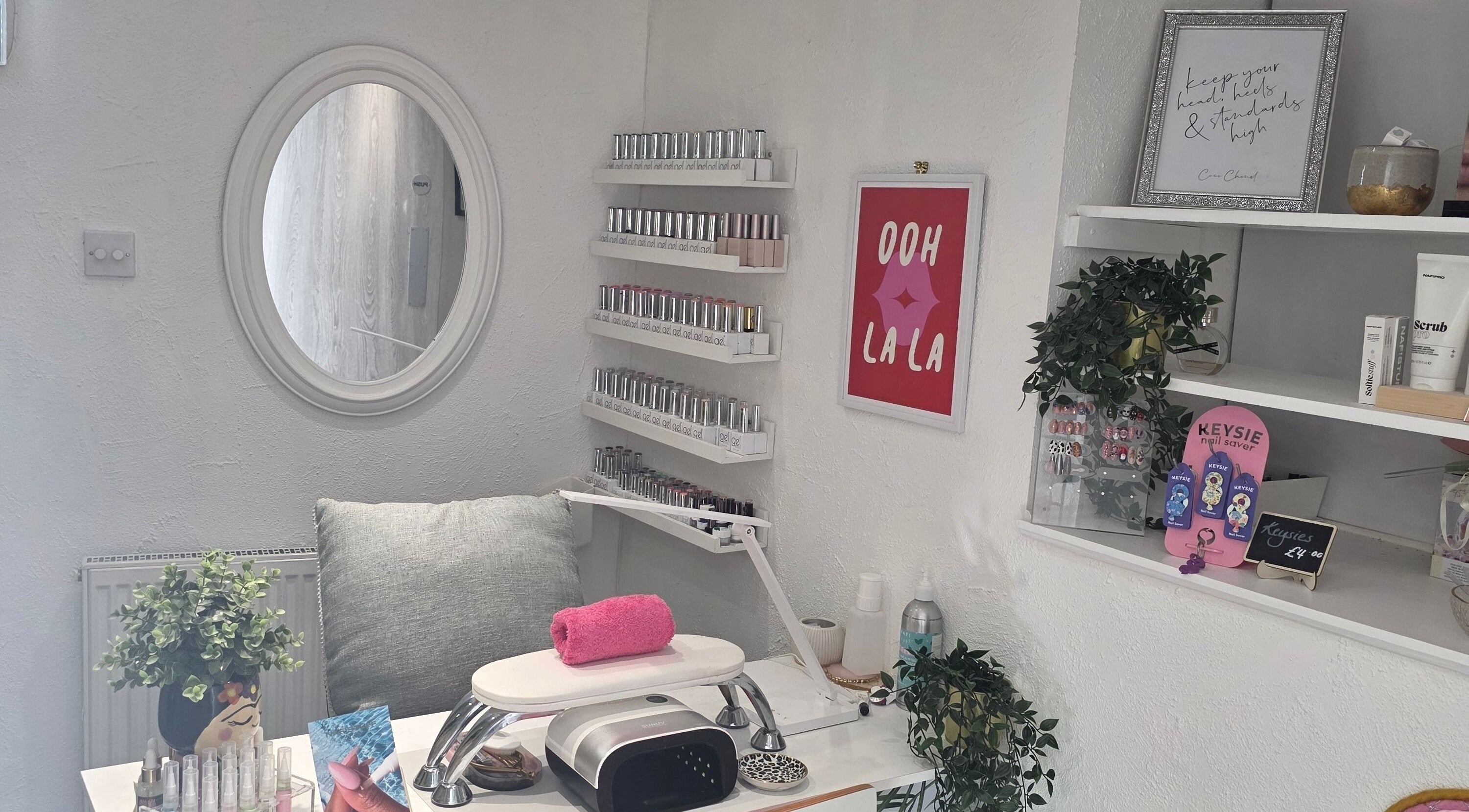 Elegant nail station at Adore Beauty, Aberdeen, Scotland, GB. Features polish display and modern decor.
