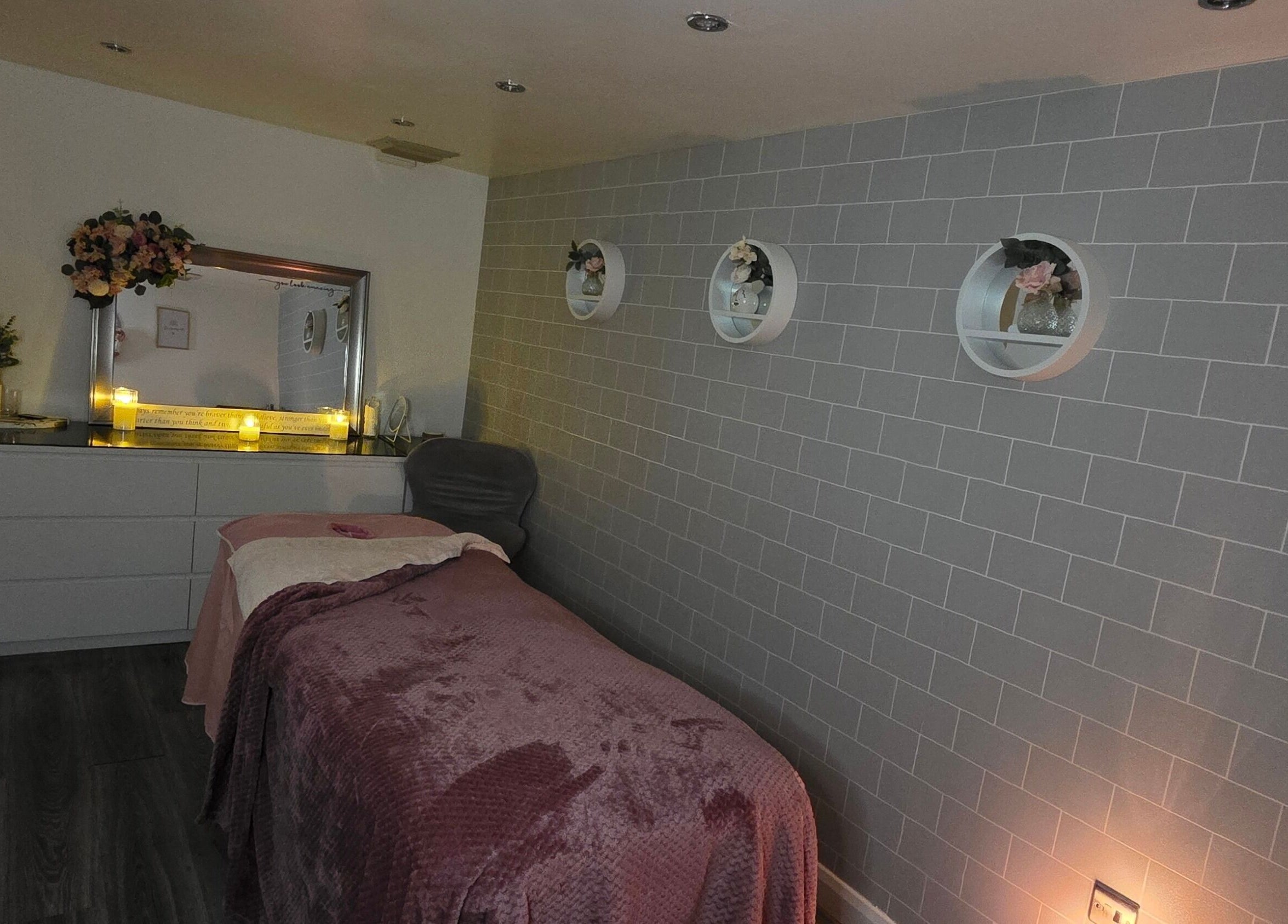 Cozy spa treatment room with soft lighting at Adore Beauty, Aberdeen, Scotland, GB.