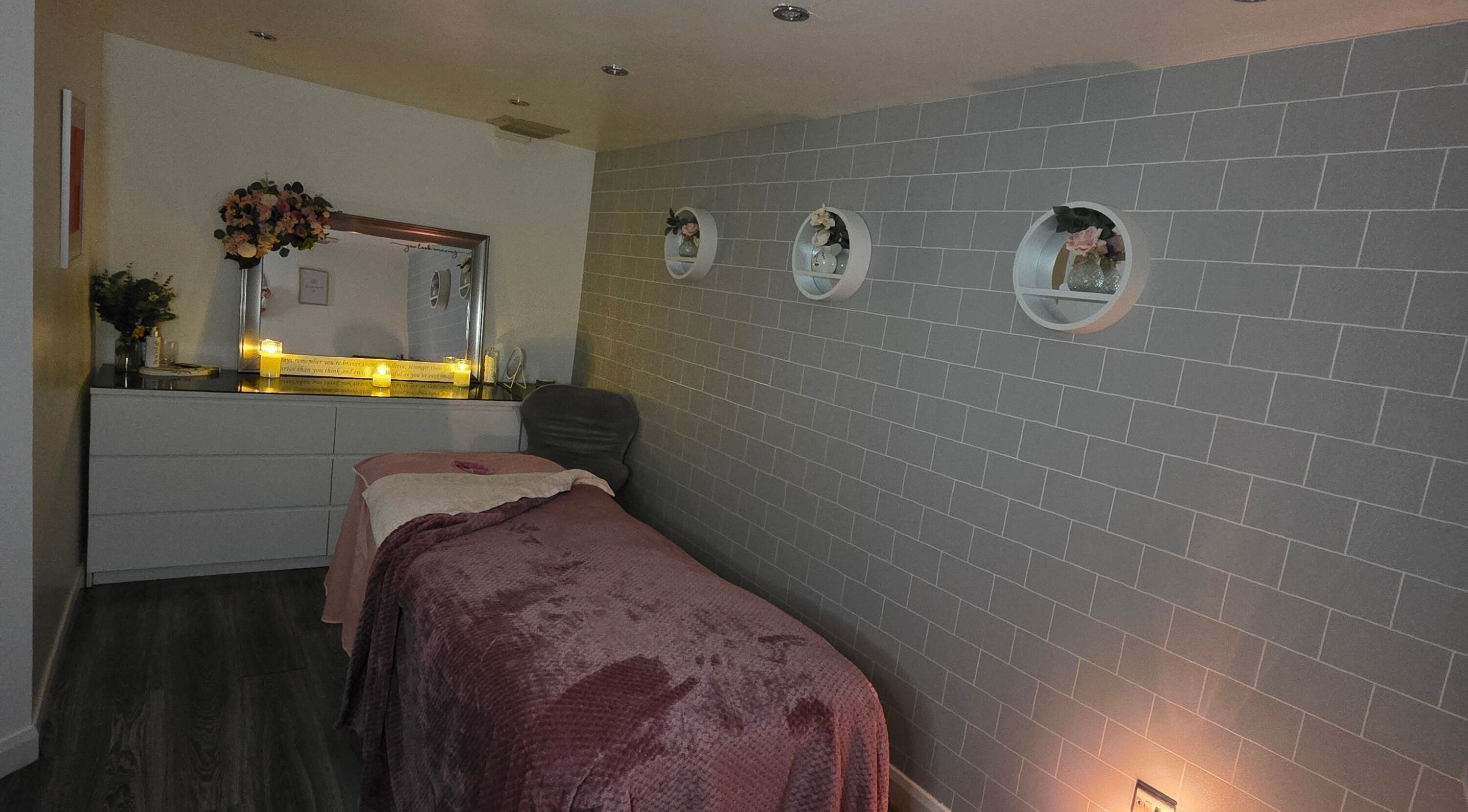 Cozy spa treatment room with soft lighting at Adore Beauty, Aberdeen, Scotland, GB.