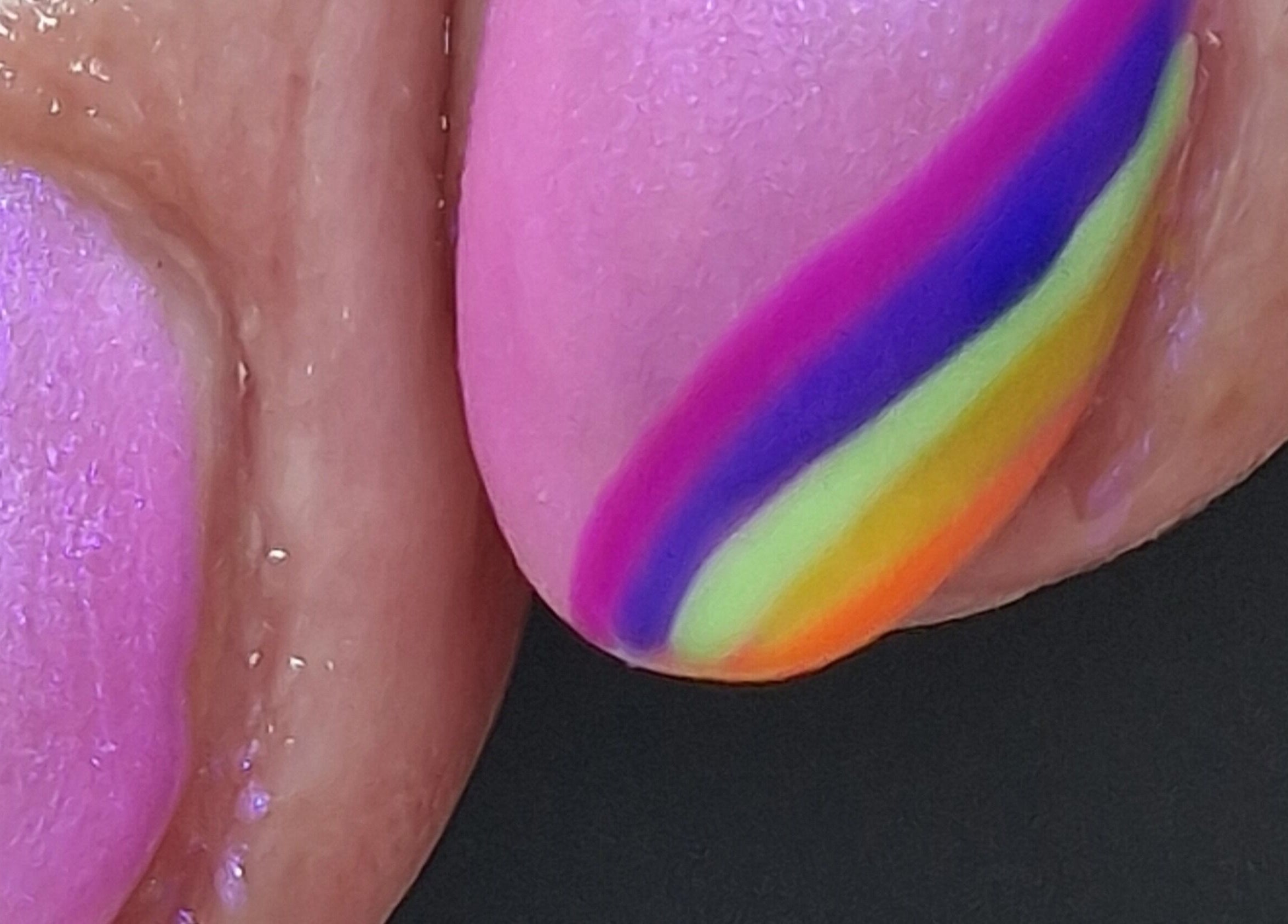 Colorful rainbow nail art at Adore Beauty in Aberdeen, Scotland, GB. Vibrant and unique design for a stylish look.